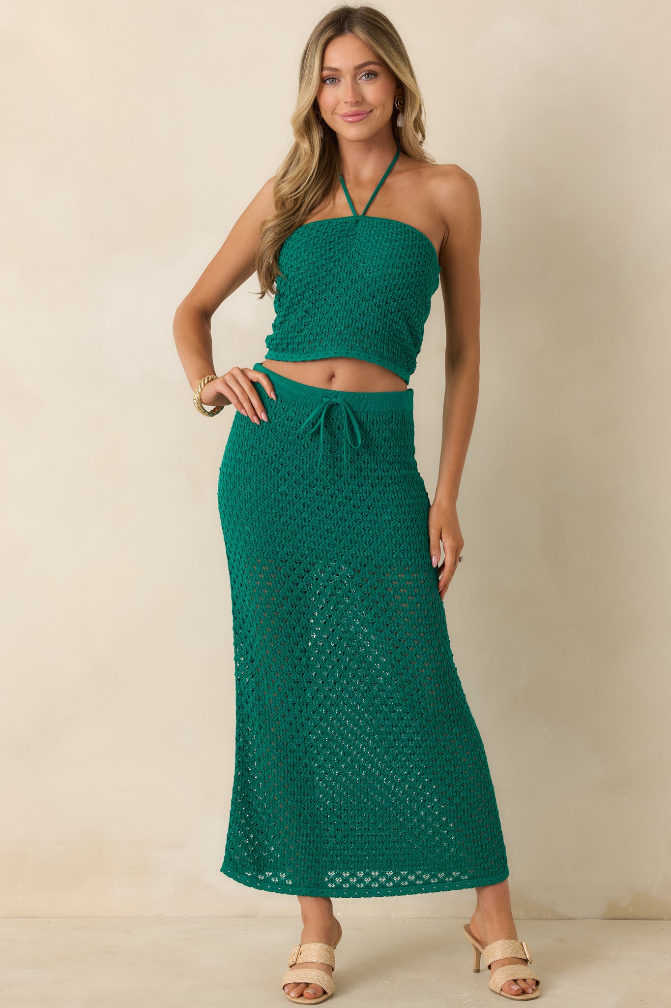 Textured crochet crop top featuring a fitted design, subtle stretch, and a versatile halter neckline.