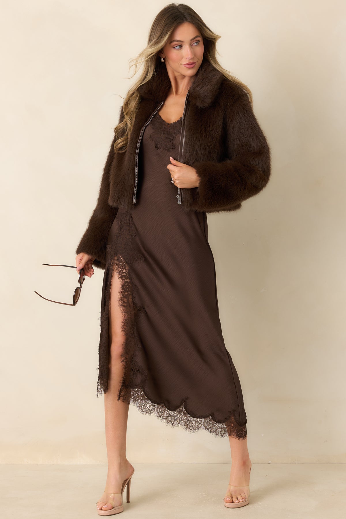 Textured faux fur coat featuring a wide collar and front zipper.