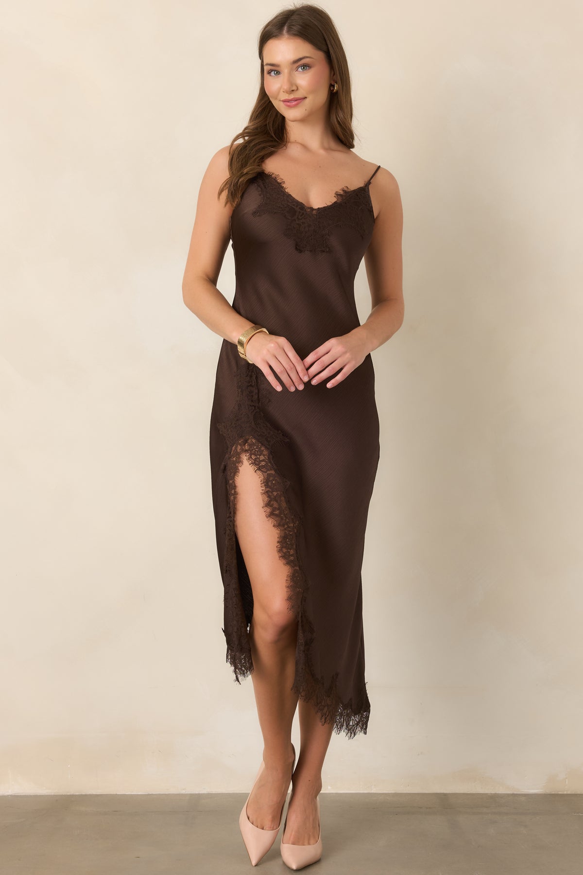 Elegant pull-on midi dress crafted in softly textured satin with fine eyelash lace accents, a figure-skimming bias cut, and delicate shoulder straps.
