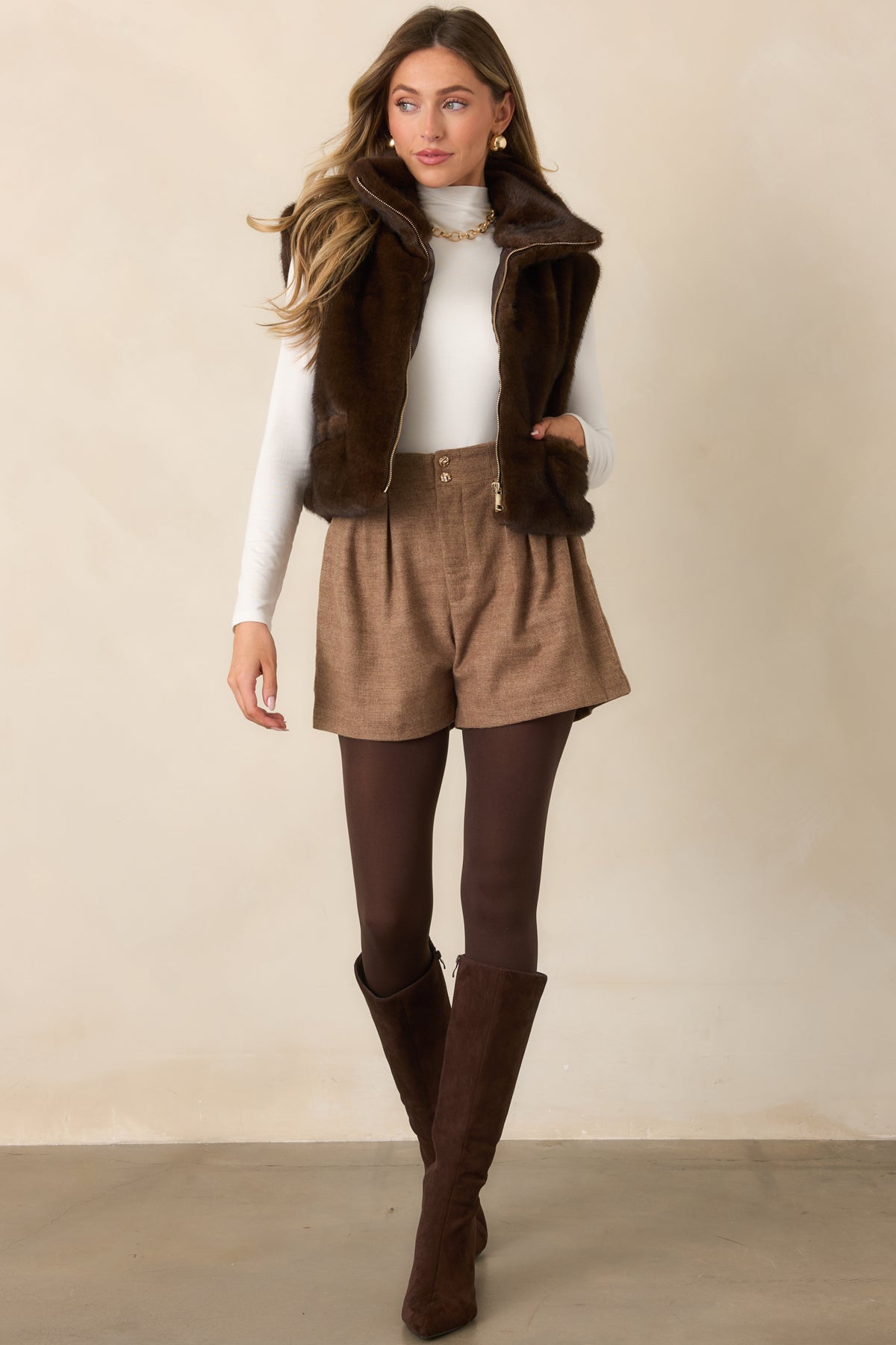 Textured taupe shorts with a high waistband, front pleats, roomy leg openings, and sculpted gold-tone buttons.