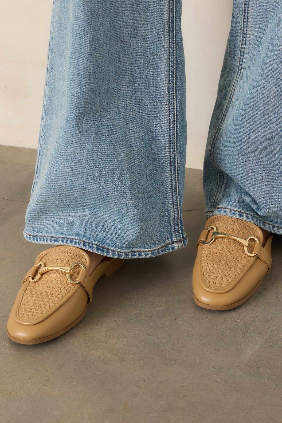 Woven mules with a textured upper, gold-tone hardware detail, and open-back design.