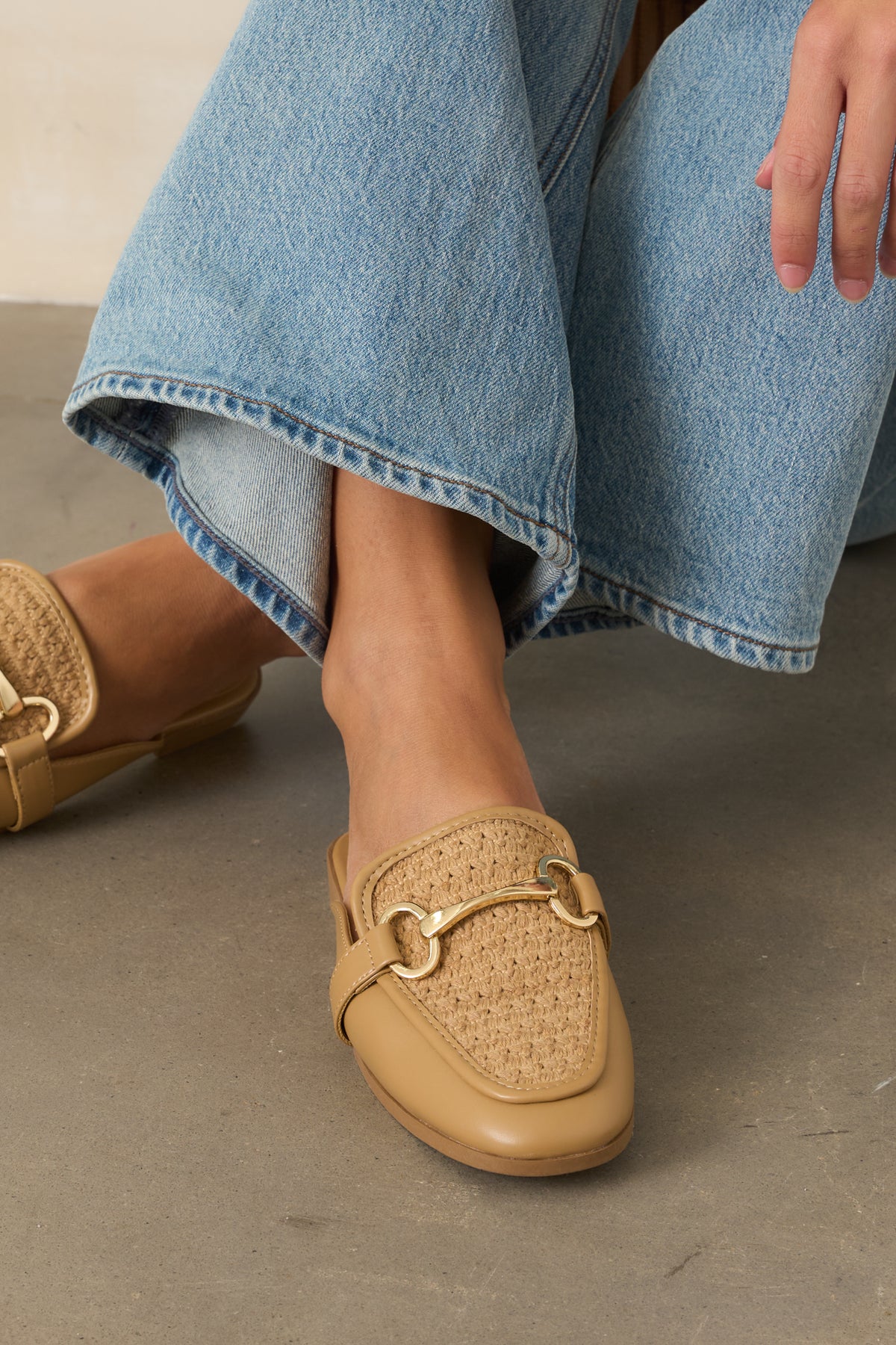 Textured woven loafers featuring refined gold-tone hardware and an easy open-back silhouette.