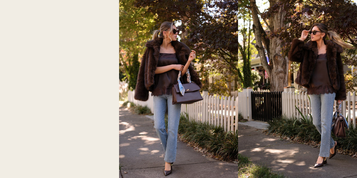 Thanksgiving layers: chocolate brown faux fur jacket over a brown satin cami with light wash straight leg jeans and a brown shoulder bag
