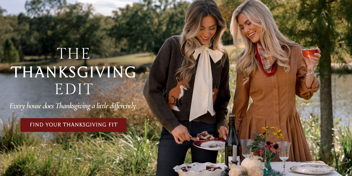 Thanksgiving Edit banner featuring two models in fall outfits beside an outdoor holiday table, with text reading "Every house does Thanksgiving a little differently" and "Find Your Thanksgiving Fit."