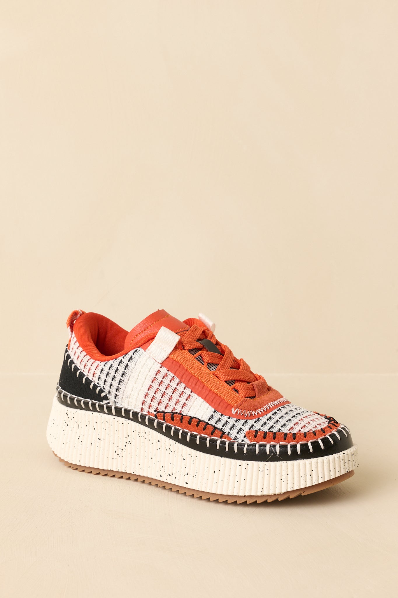 Three-quarter angle view of the platform sneakers highlighting the padded collar and cushioned footbed.