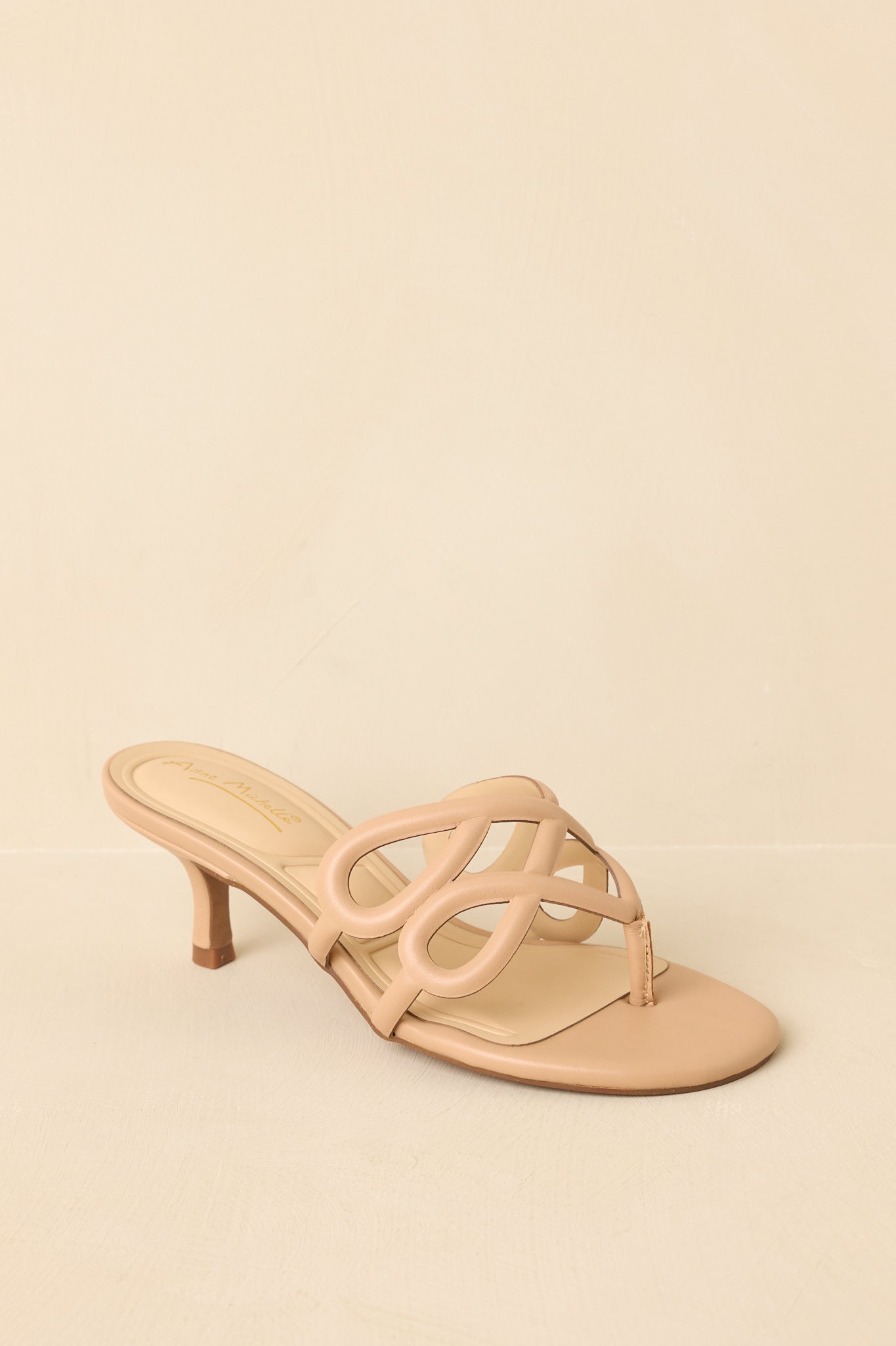 Three-quarter angle showcasing faux leather finish and looped strap design.
