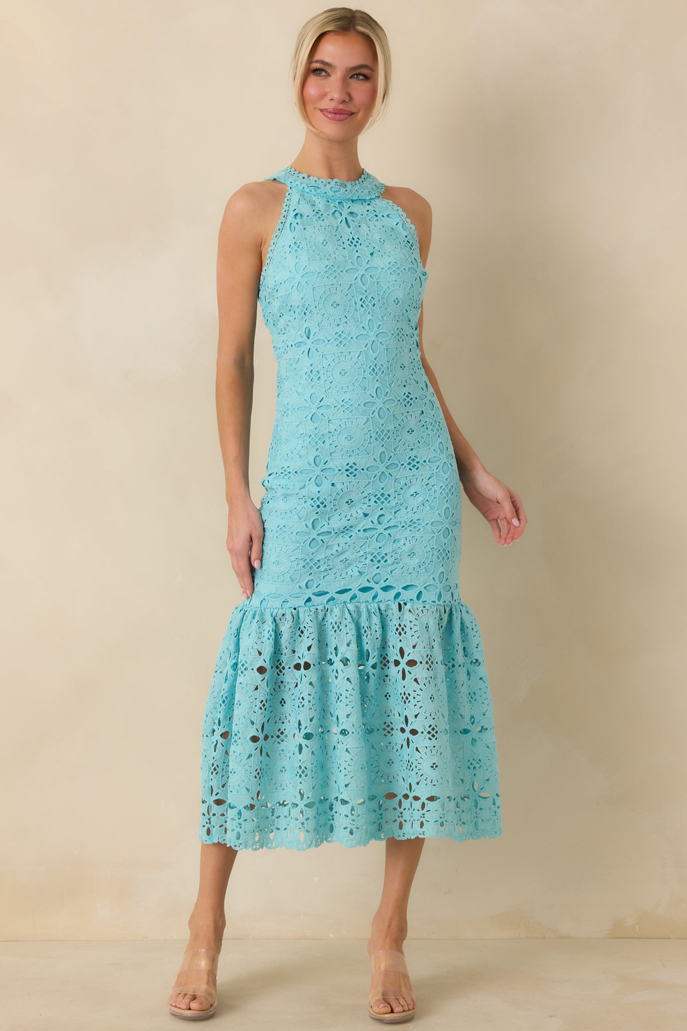 Three-quarter front angle emphasizing the open eyelet detailing along the bodice and skirt.