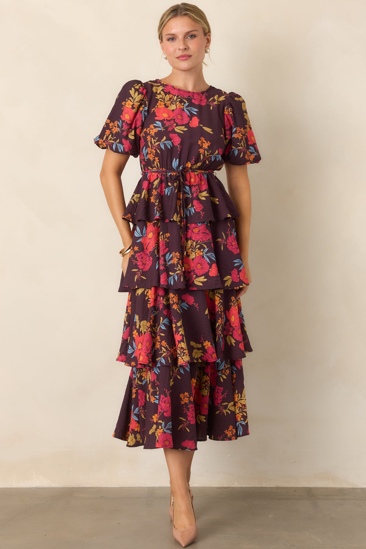 Tiered A-line maxi dress defined by a peplum-inspired layer and comfortable elasticized waist.