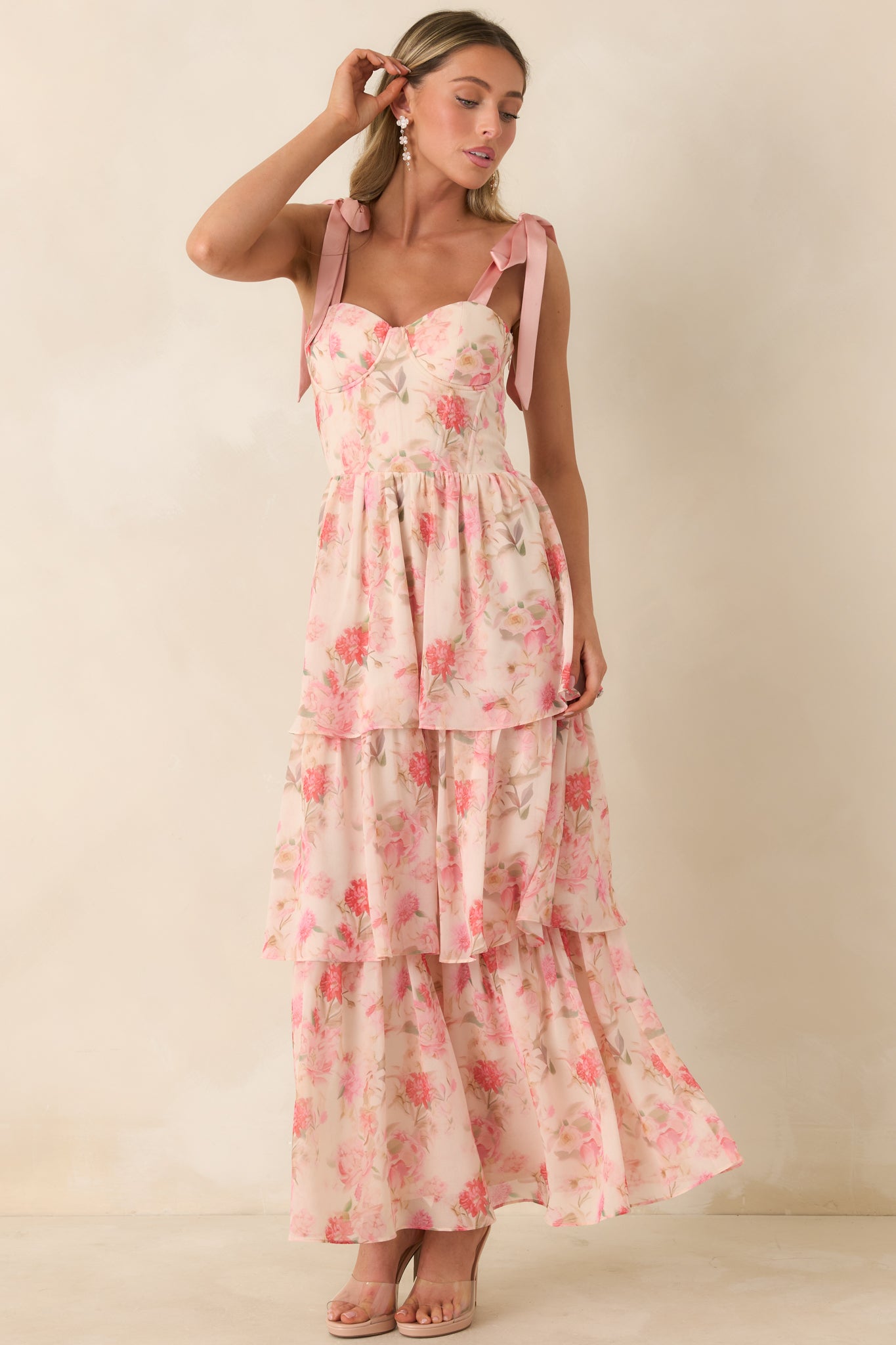 Tiered chiffon dress with adjustable straps and a graceful, flowing silhouette.