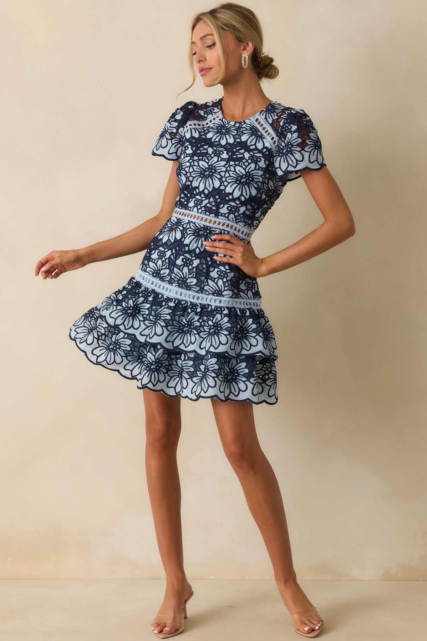 Tiered ruffle hemline highlighted with scalloped lace edges.