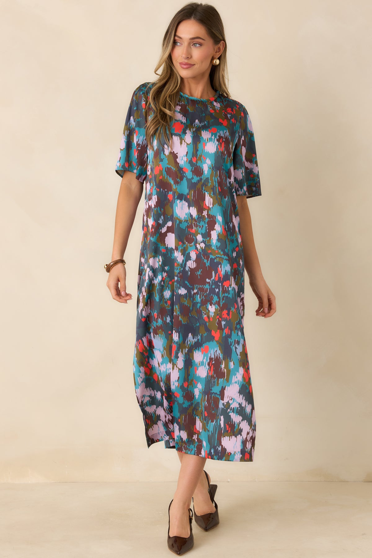 Fluid midi dress with a timeless round neckline and relaxed sleeves for a polished finish.