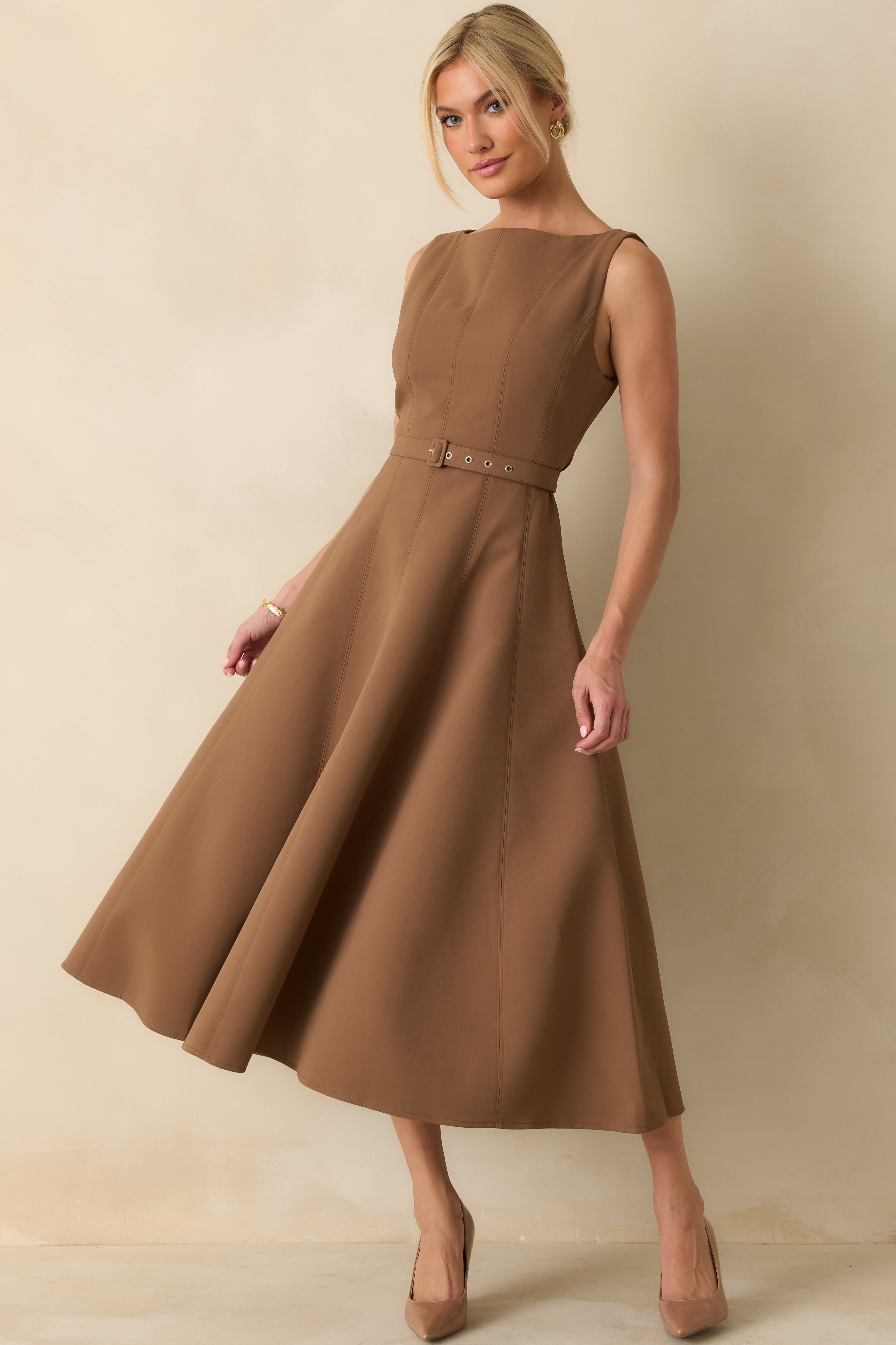 Chic toffee brown sleeveless dress featuring a flared hem and matching belt accent.