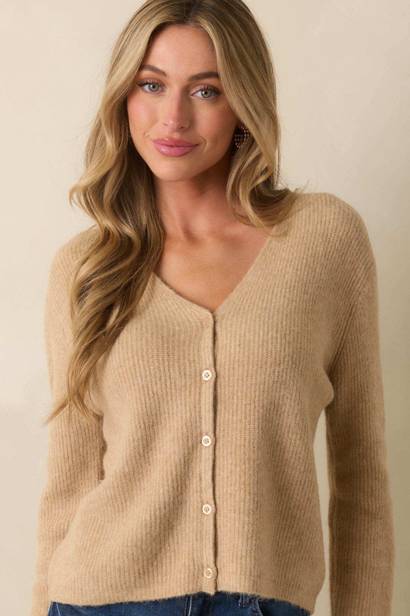 Functional tonal buttons and ribbed detailing along the button placket.