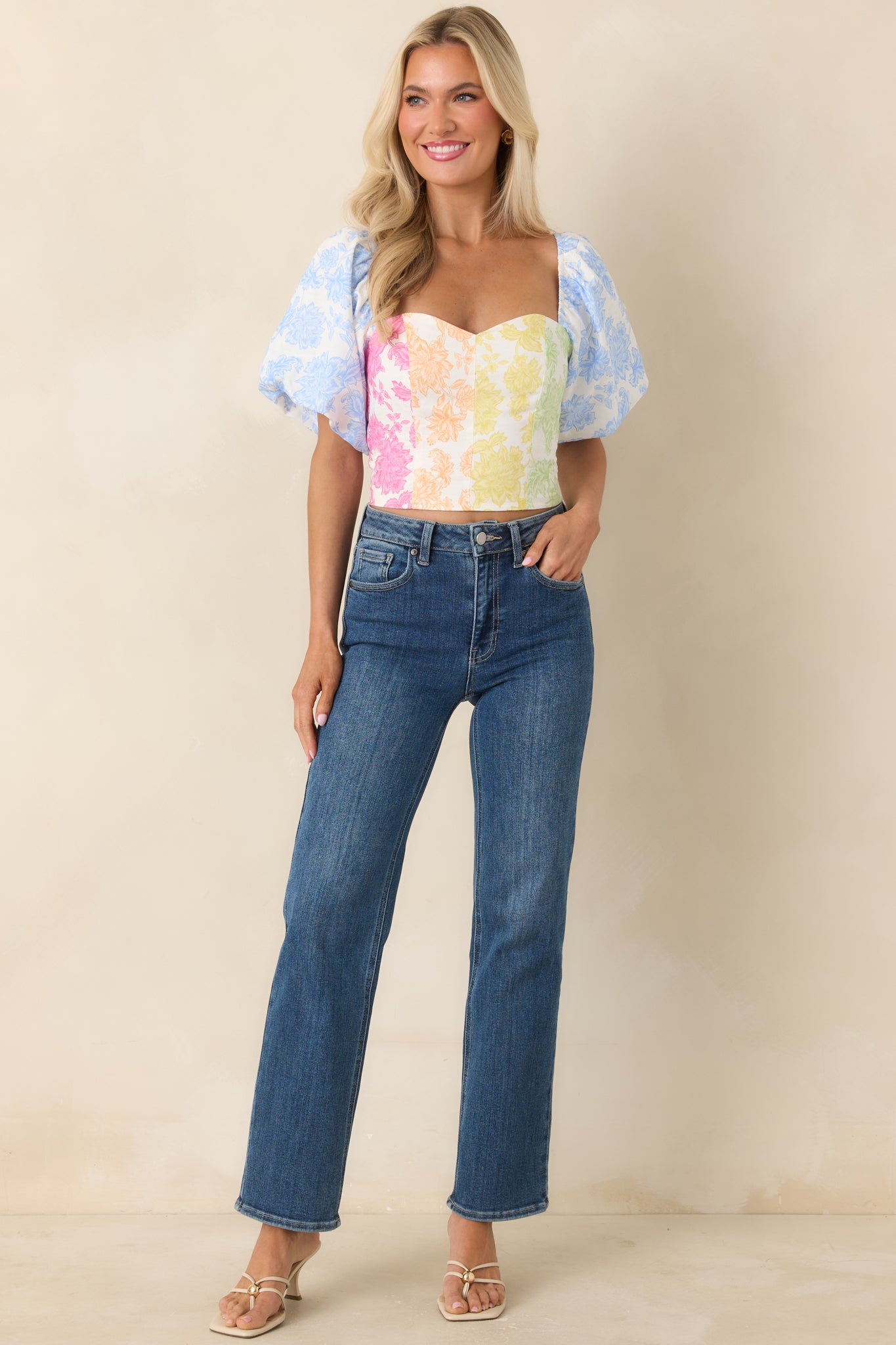 Lightweight top with tailored silhouette, soft sweetheart neckline, and colorful floral panels.