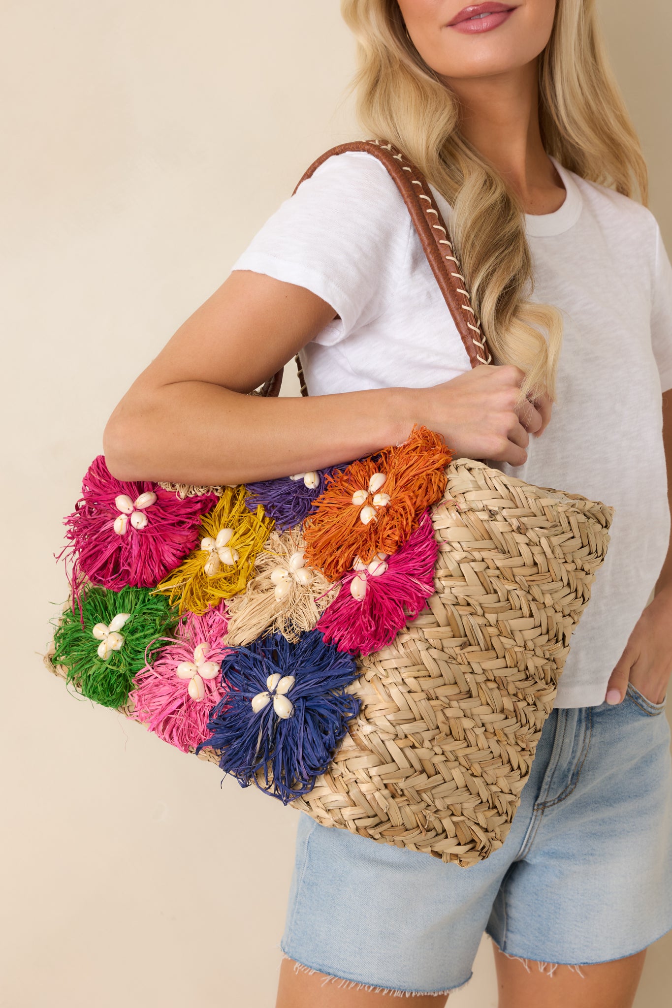 Structured tote highlighting the contrast whipstitch accents, leather-wrapped handles, and bright seasonal design.