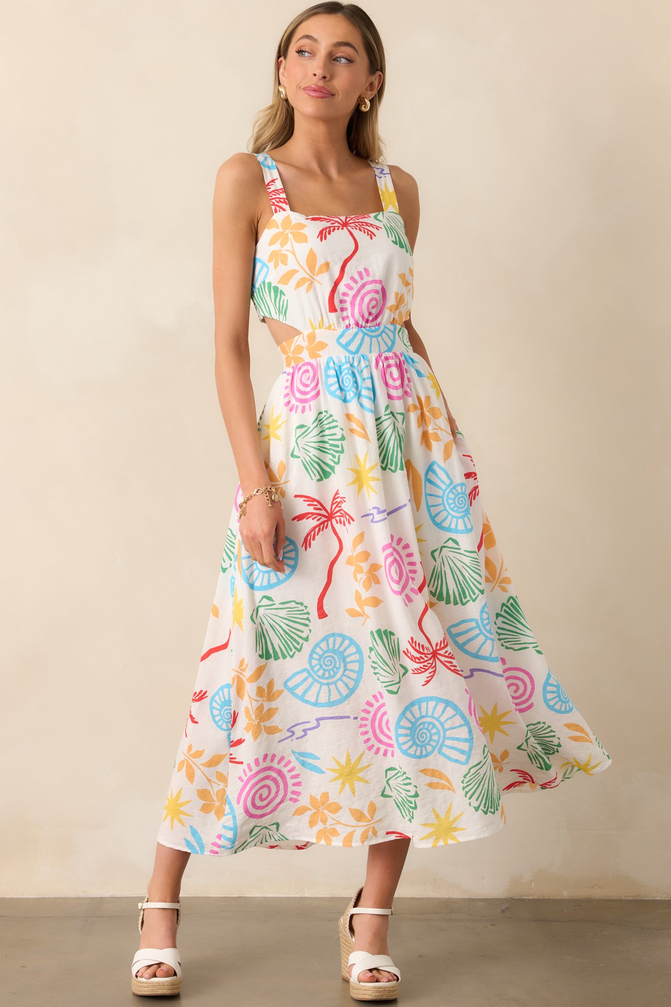  Tropical-print maxi dress in ivory, designed with elastic strap inserts and a breezy, floor-length fit.