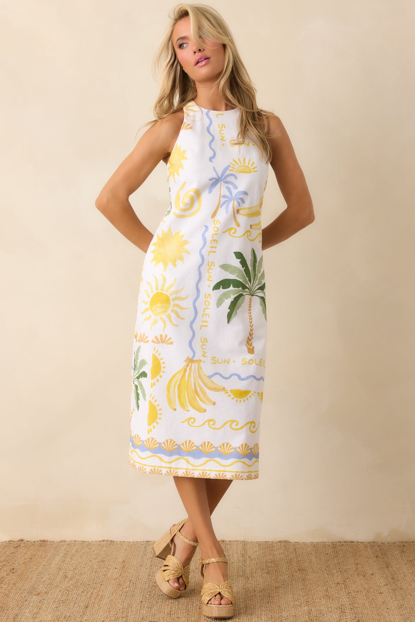 Tropical print tank top featuring a lightweight, airy structure with wide shoulder straps and a softly cropped length designed for effortless warm-weather styling.