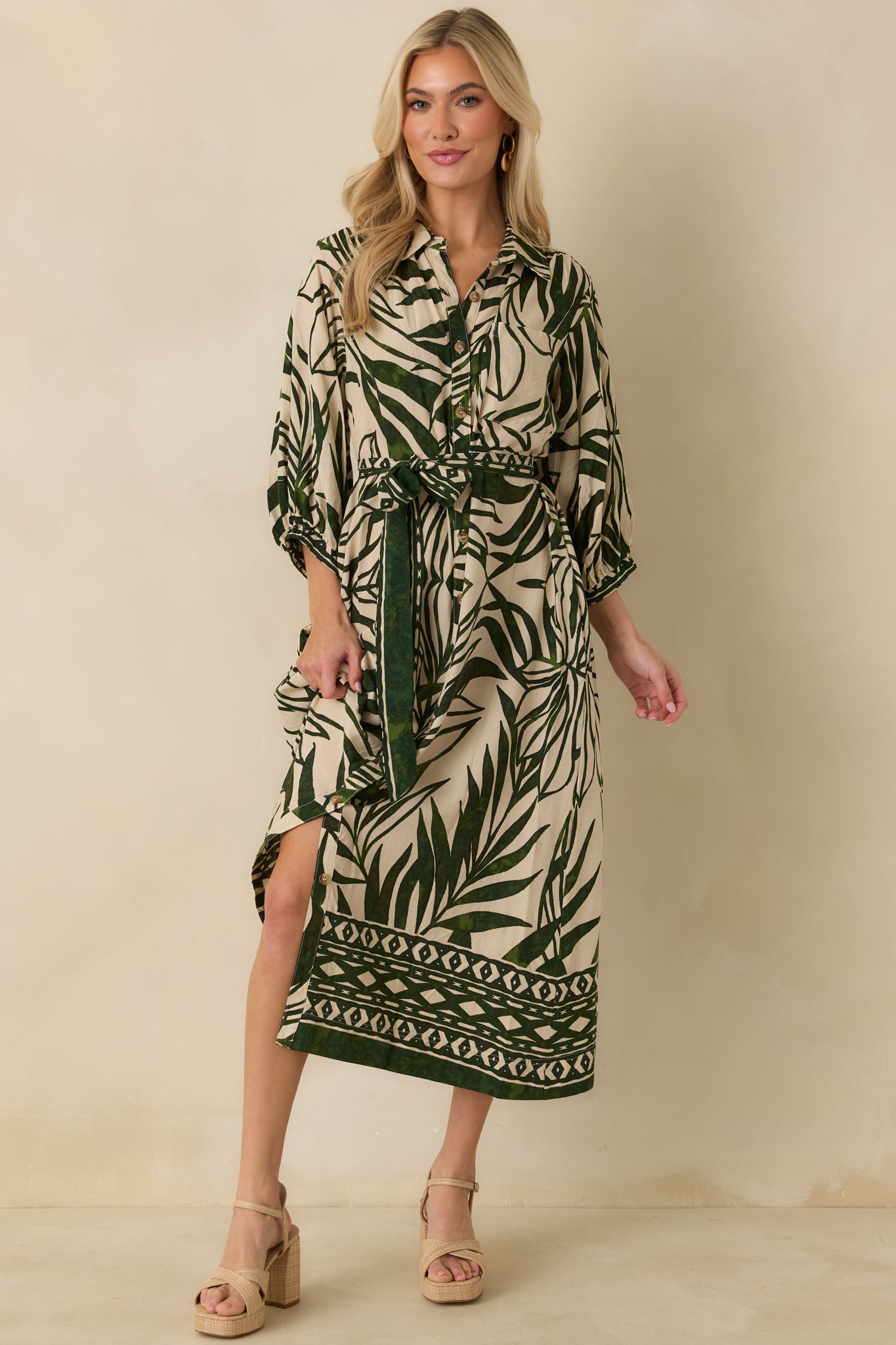 Tropical print maxi dress showcasing collared bodice, 3/4 sleeves, and lightweight woven fabric.