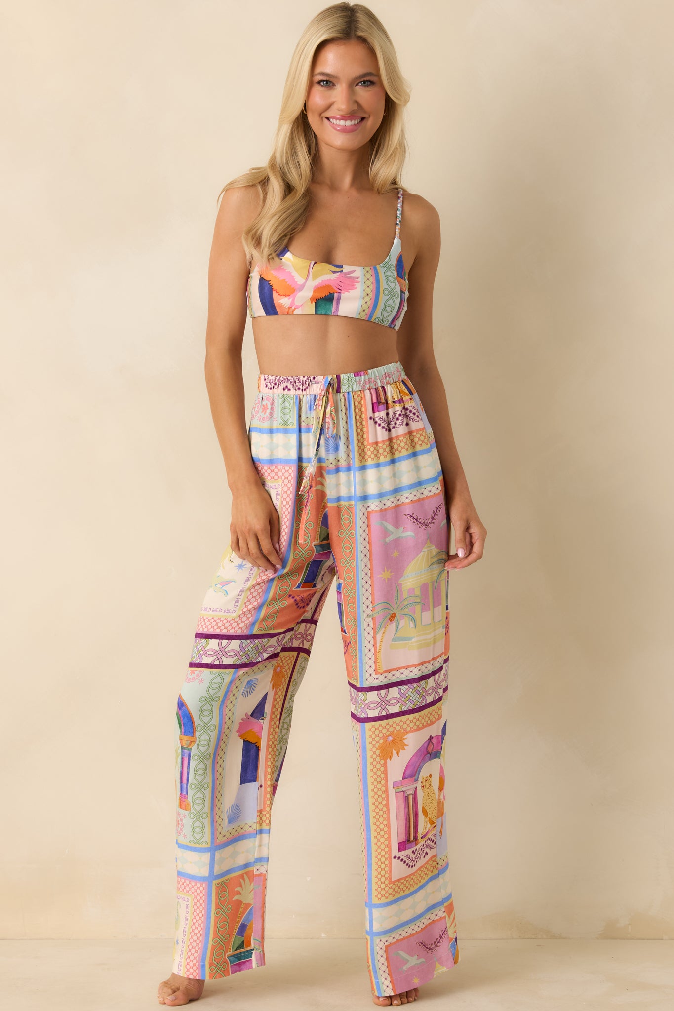 Tropical tile-patterned pants highlighting the airy woven texture, relaxed silhouette, and adjustable drawstring waist.