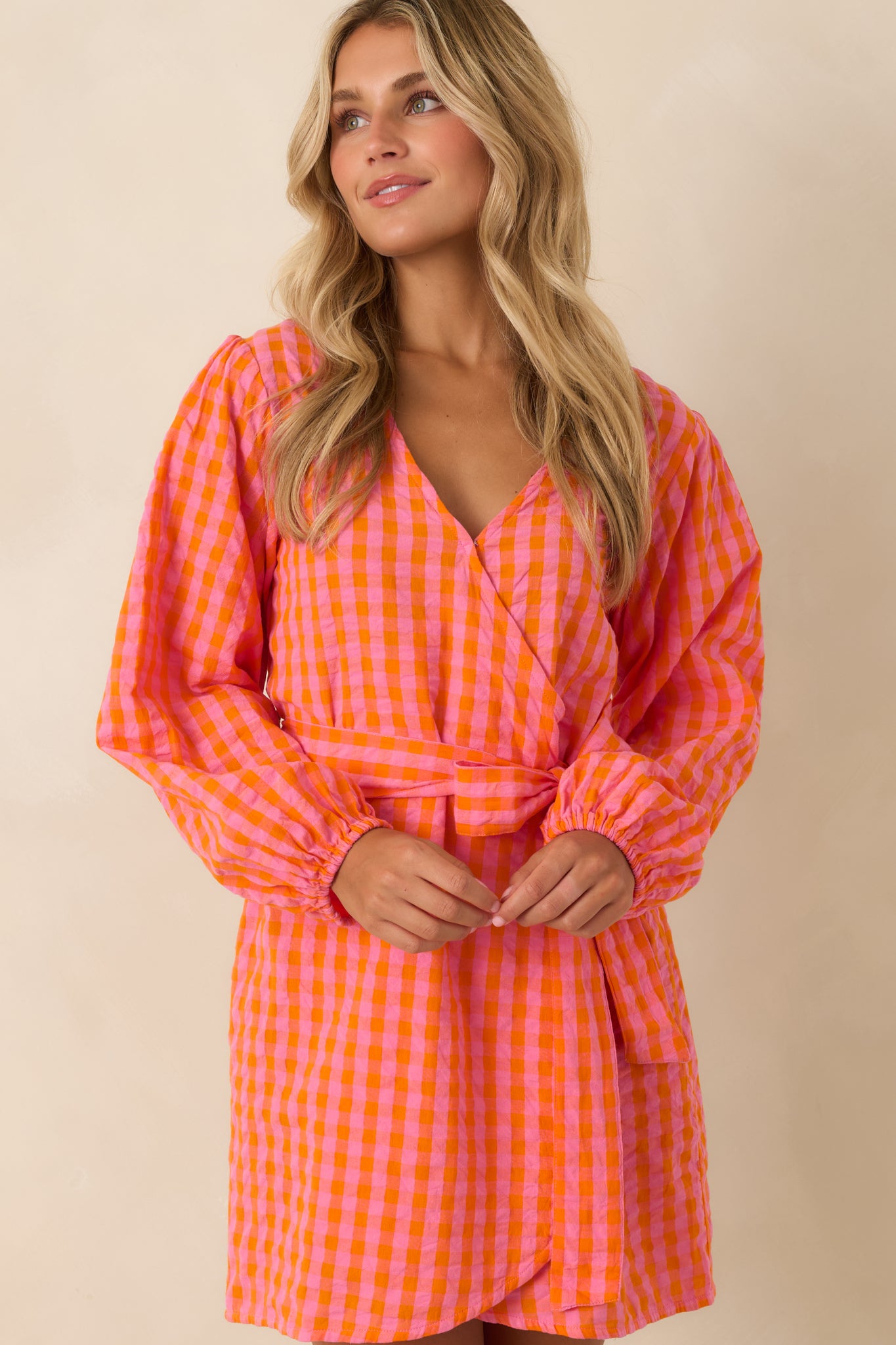 Tulip-style wrap skirt adds graceful movement and a feminine finish to this vibrant cotton mini dress.