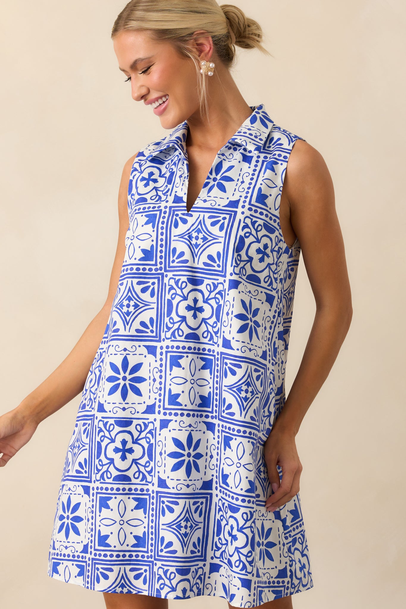 Upper section of the dress with a look at the small v-neckline and bold tile motif.