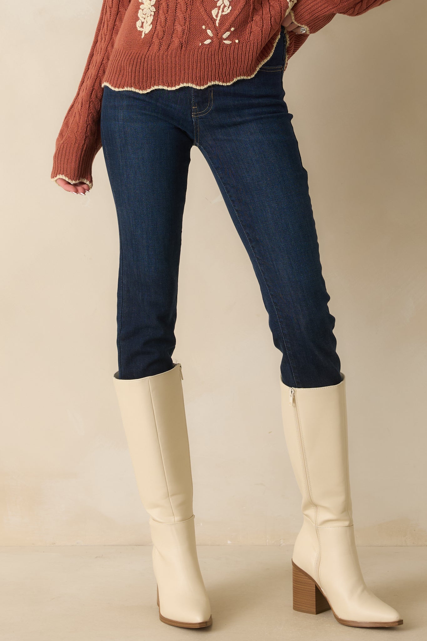 Cropped photo highlighting the upper thigh and tan topstitch details along the seams.