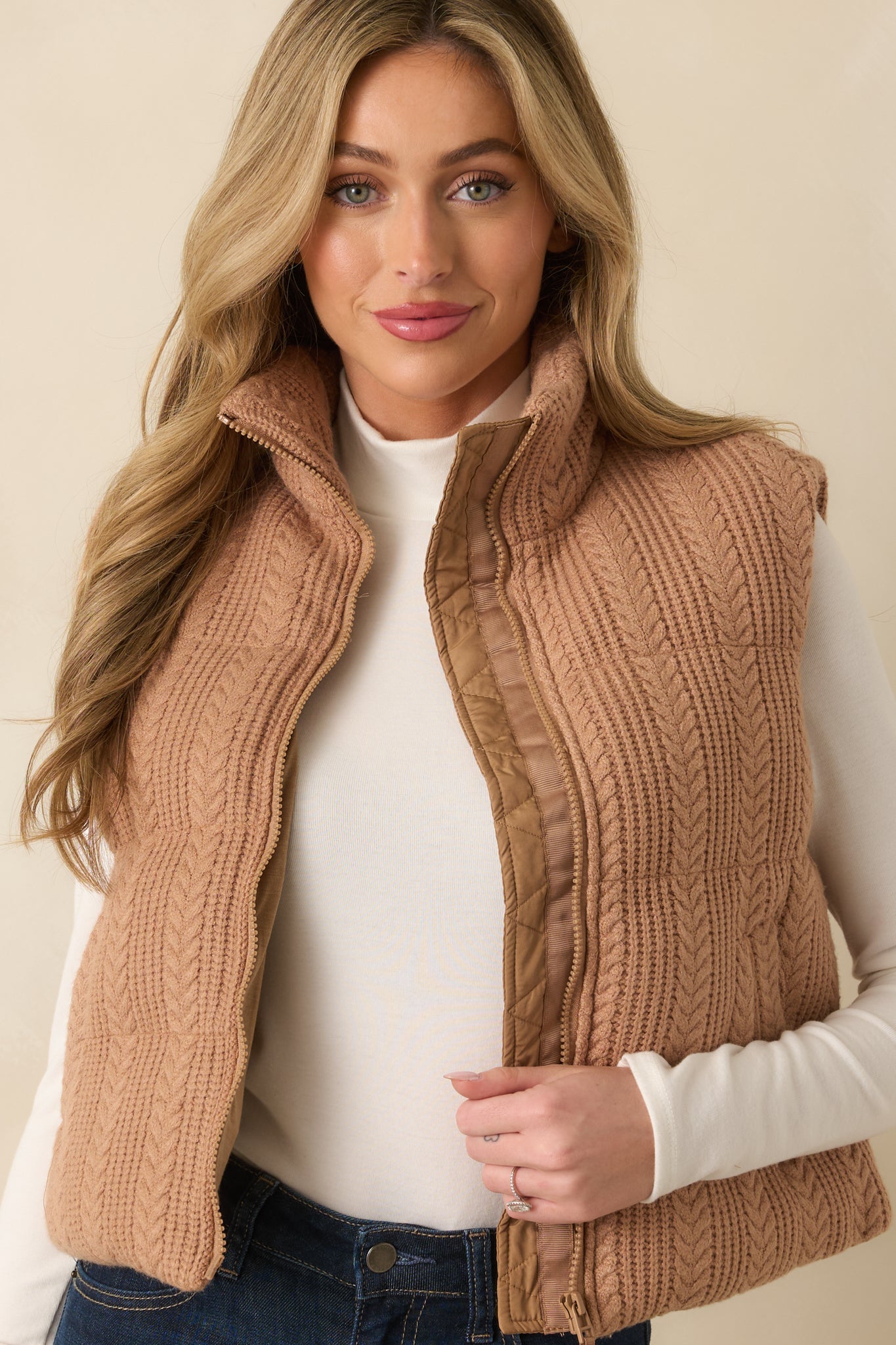 Upper torso crop highlighting the high stand collar, quilted pattern, and smooth lining visible inside.