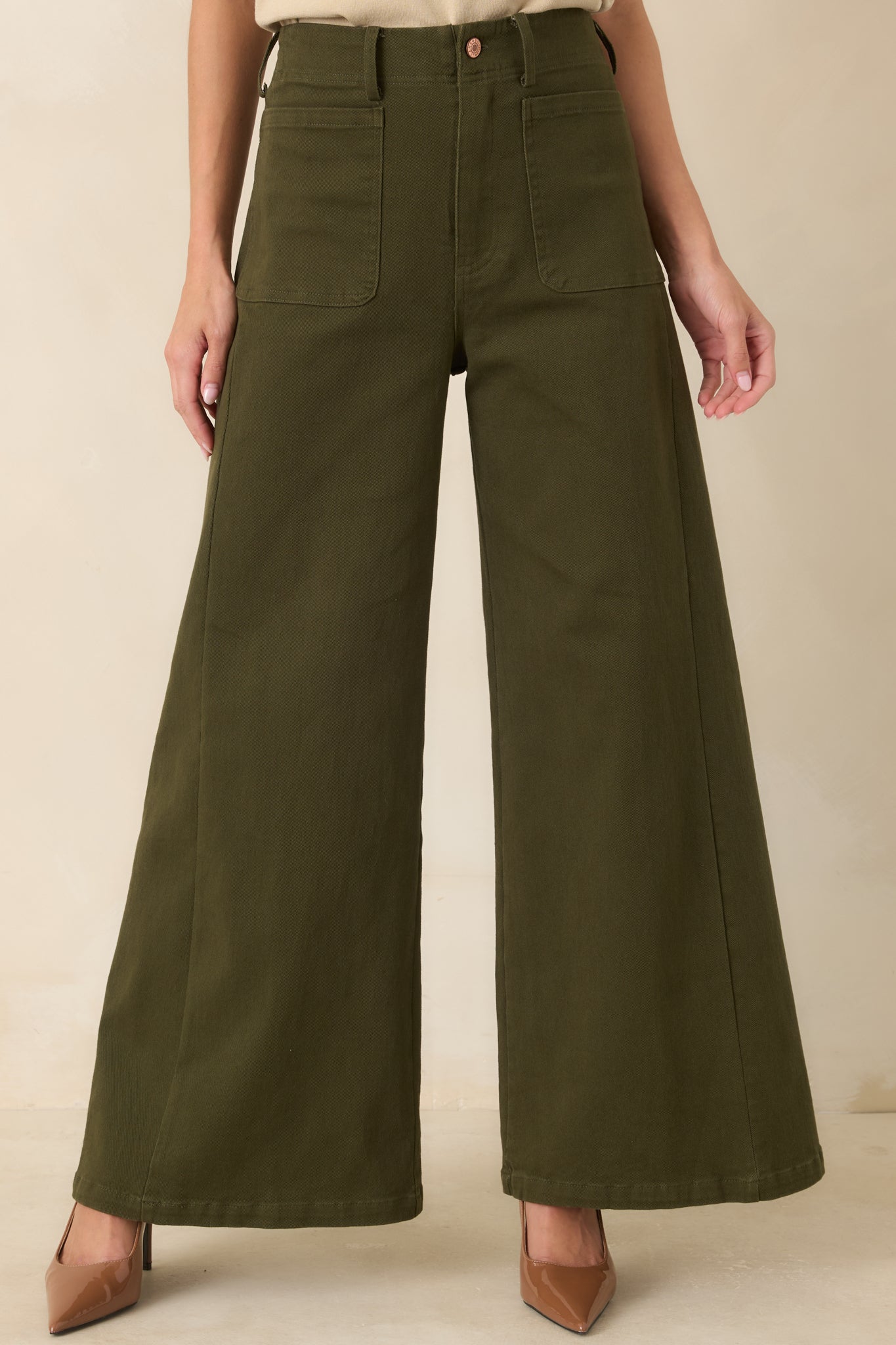 Front detail of the pants showcasing the utility-inspired pocket design and clean, tailored silhouette.