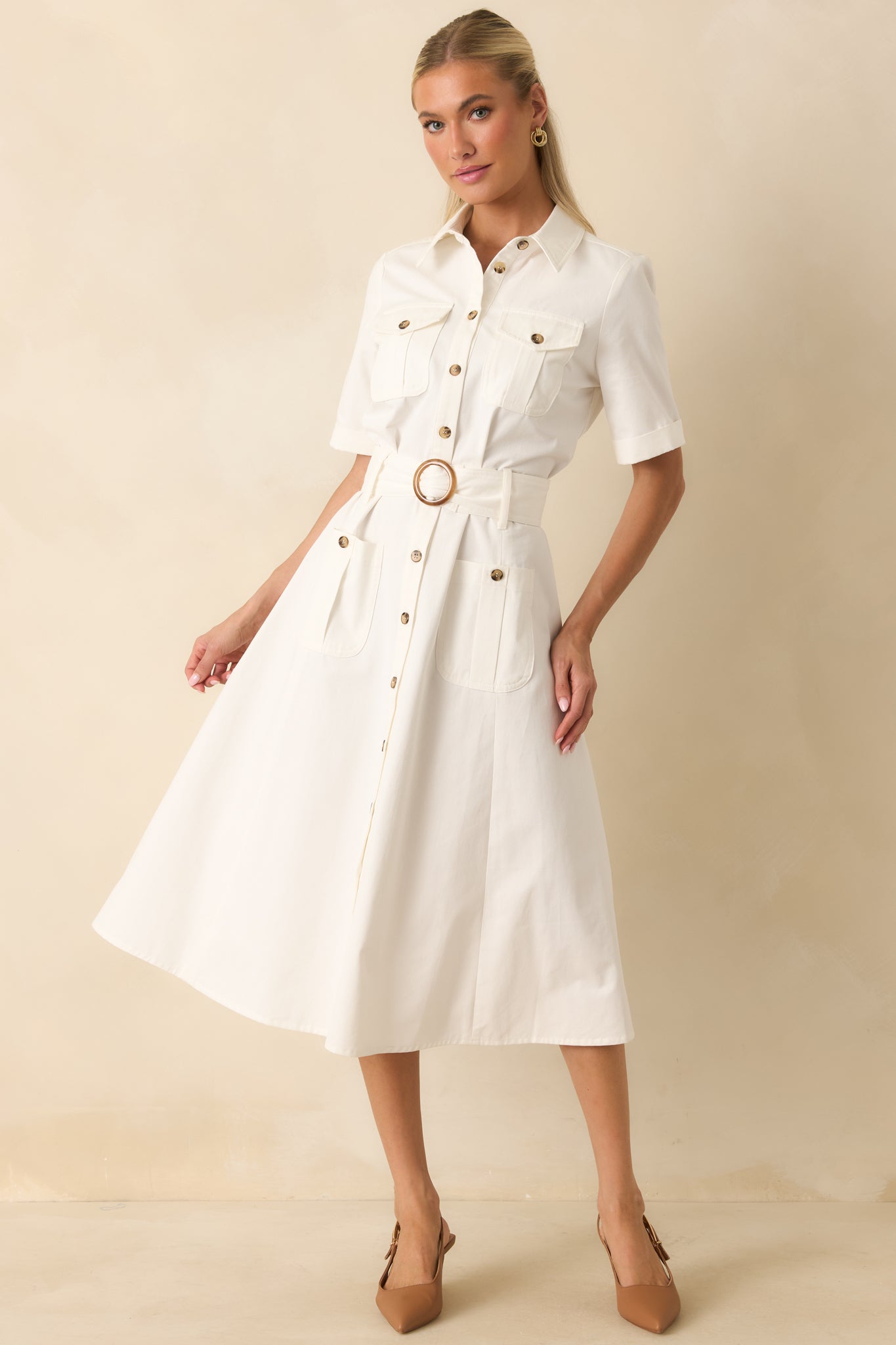 Structured midi dress with utility-inspired flap chest pockets, front patch pockets, and a flattering fit-and-flare silhouette.