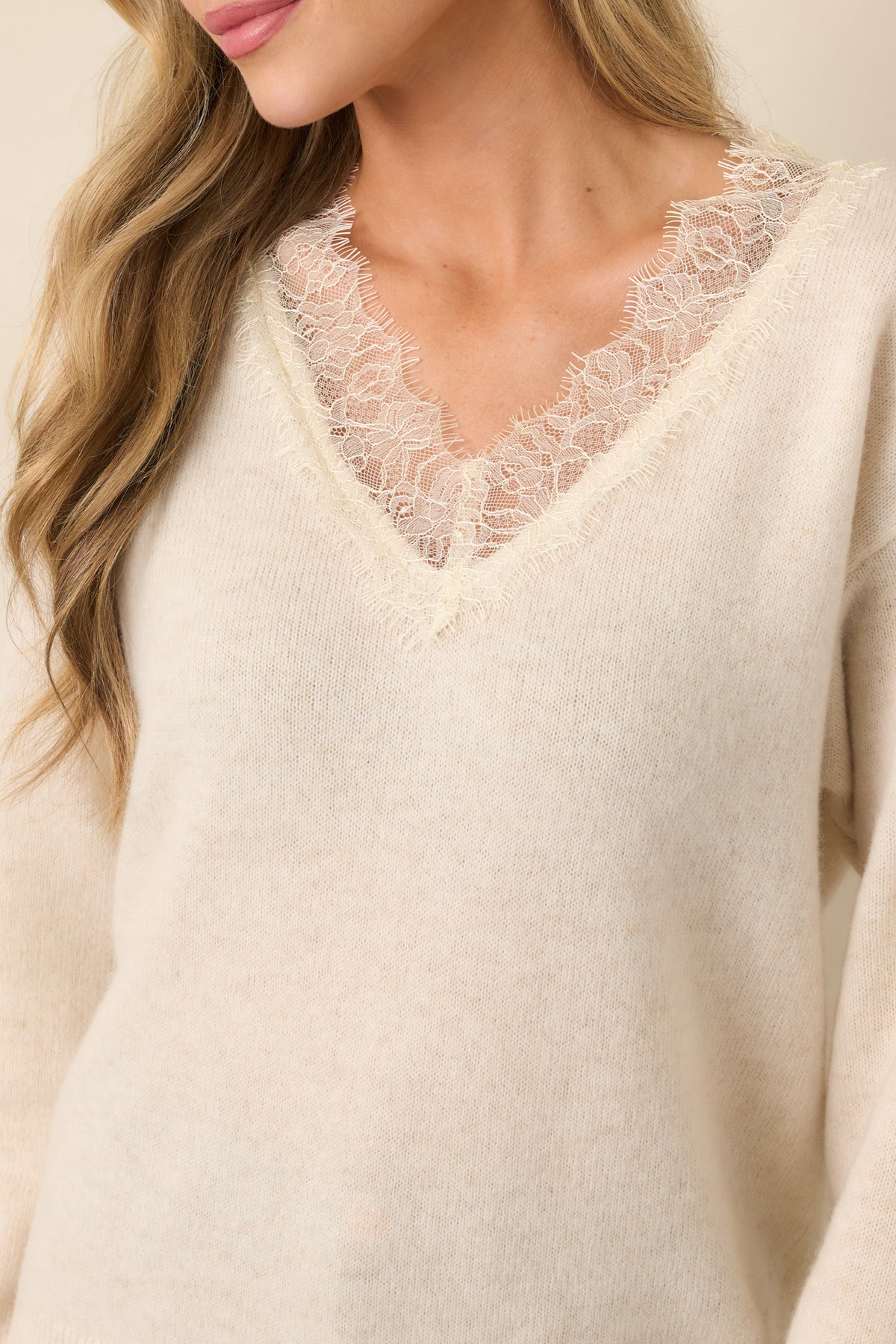 V-neckline detail framed by delicate romantic lace trim.