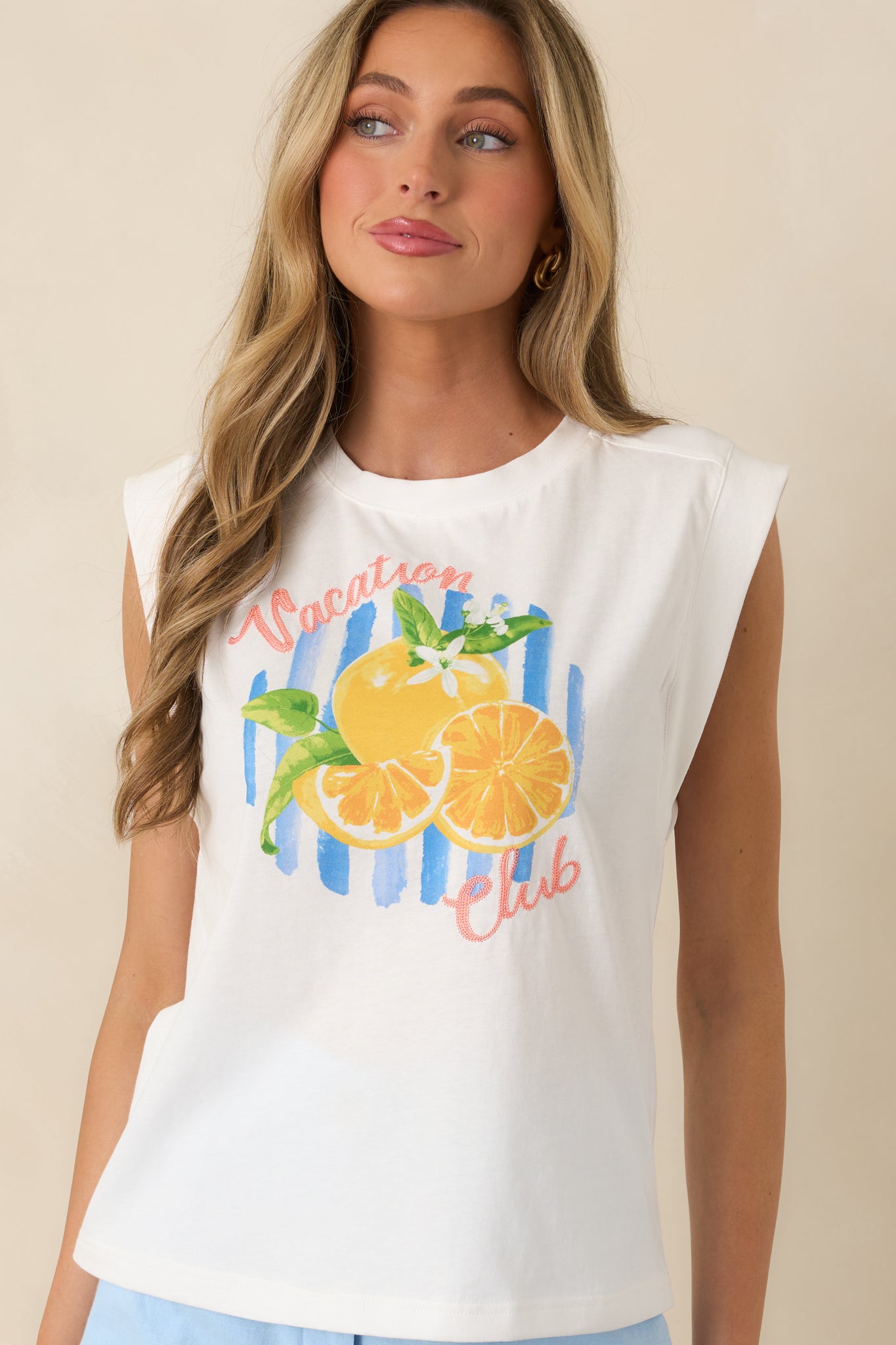 “Vacation Club” lettering detail on lightweight, breathable 100% cotton fabric.