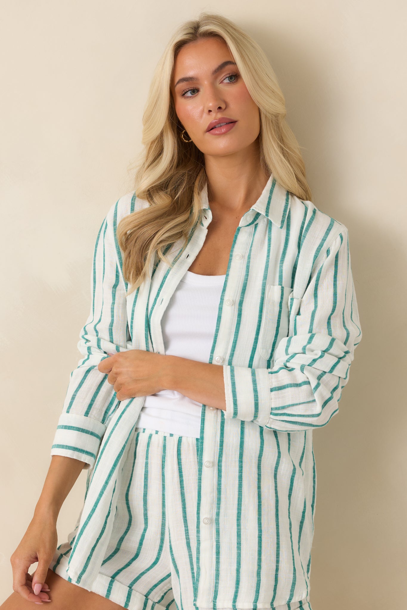 Closer view of the vertical stripe pattern and breathable cotton gauze fabric highlighting the shirt’s coastal-inspired style.