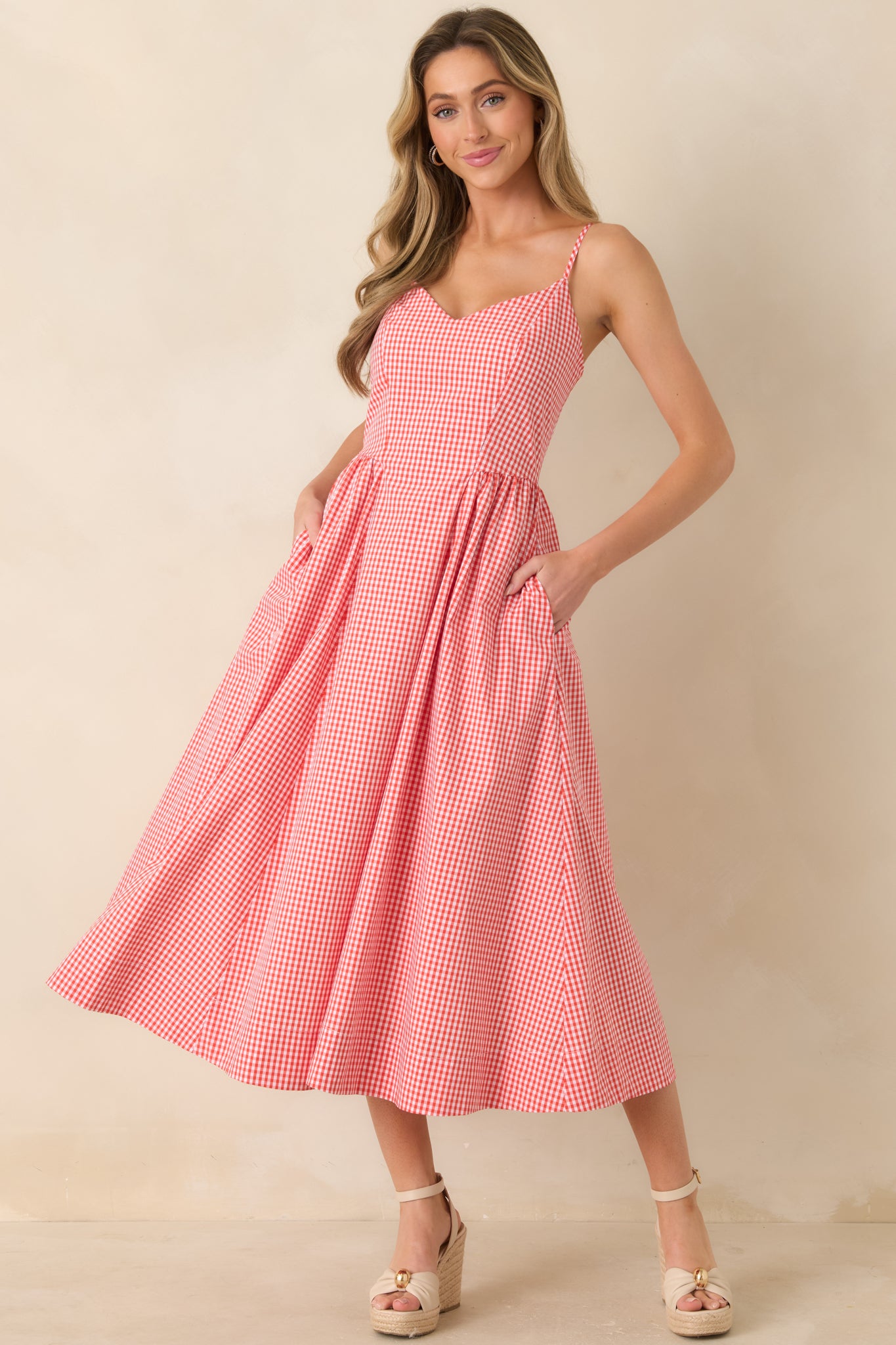 Vertical striped midi dress with delicate straps and a relaxed, polished silhouette.