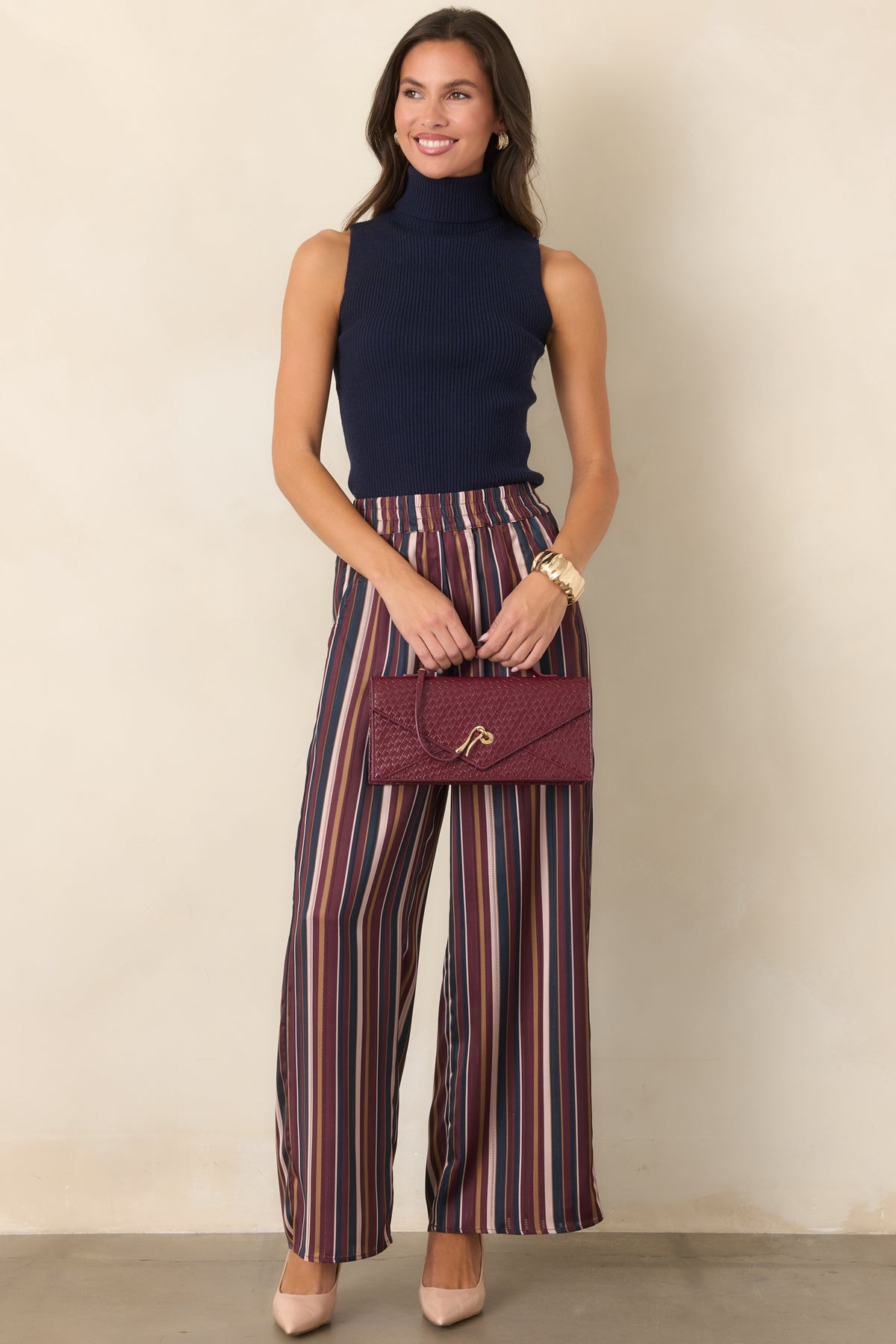 Striped satin pants with a wide leg silhouette and smooth drape from the hips to the hem.