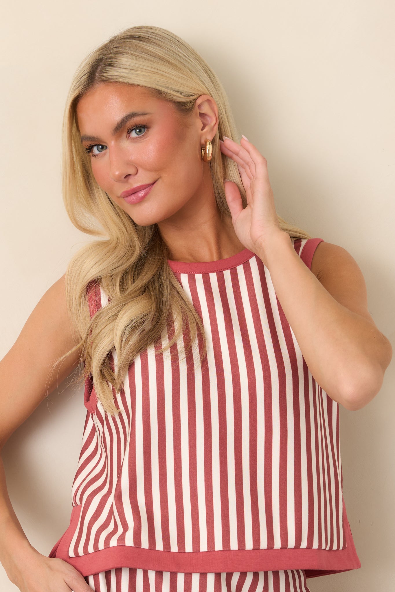 Vertical terracotta and ivory stripes define this sleeveless top, with contrast terracotta edging framing the neckline and cropped silhouette.