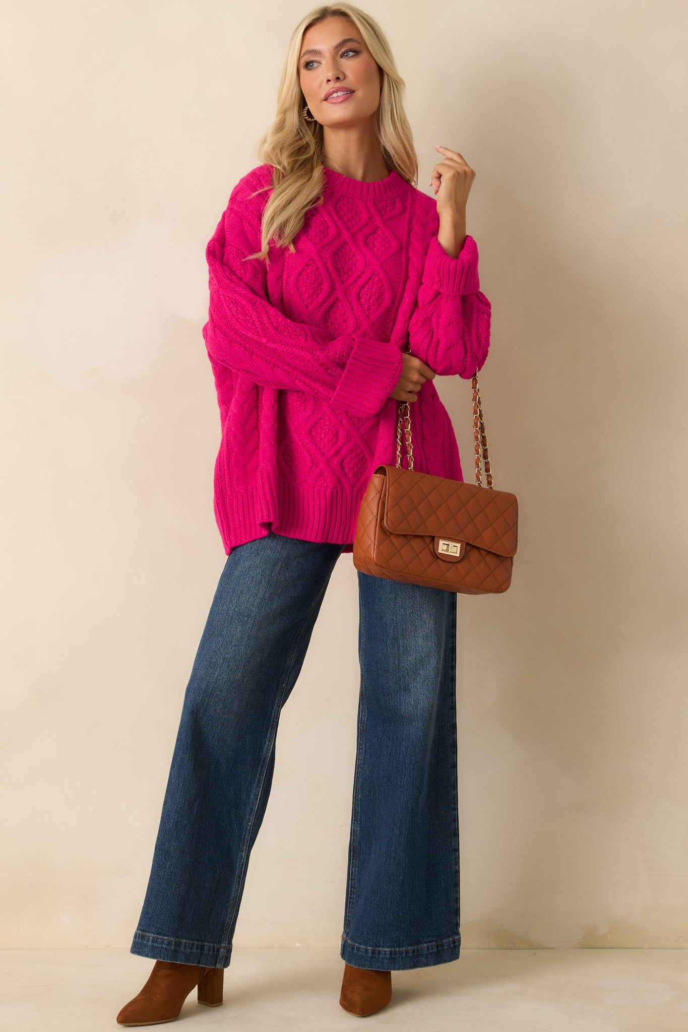 Vibrant pink sweater in a loose silhouette designed for all-day comfort.