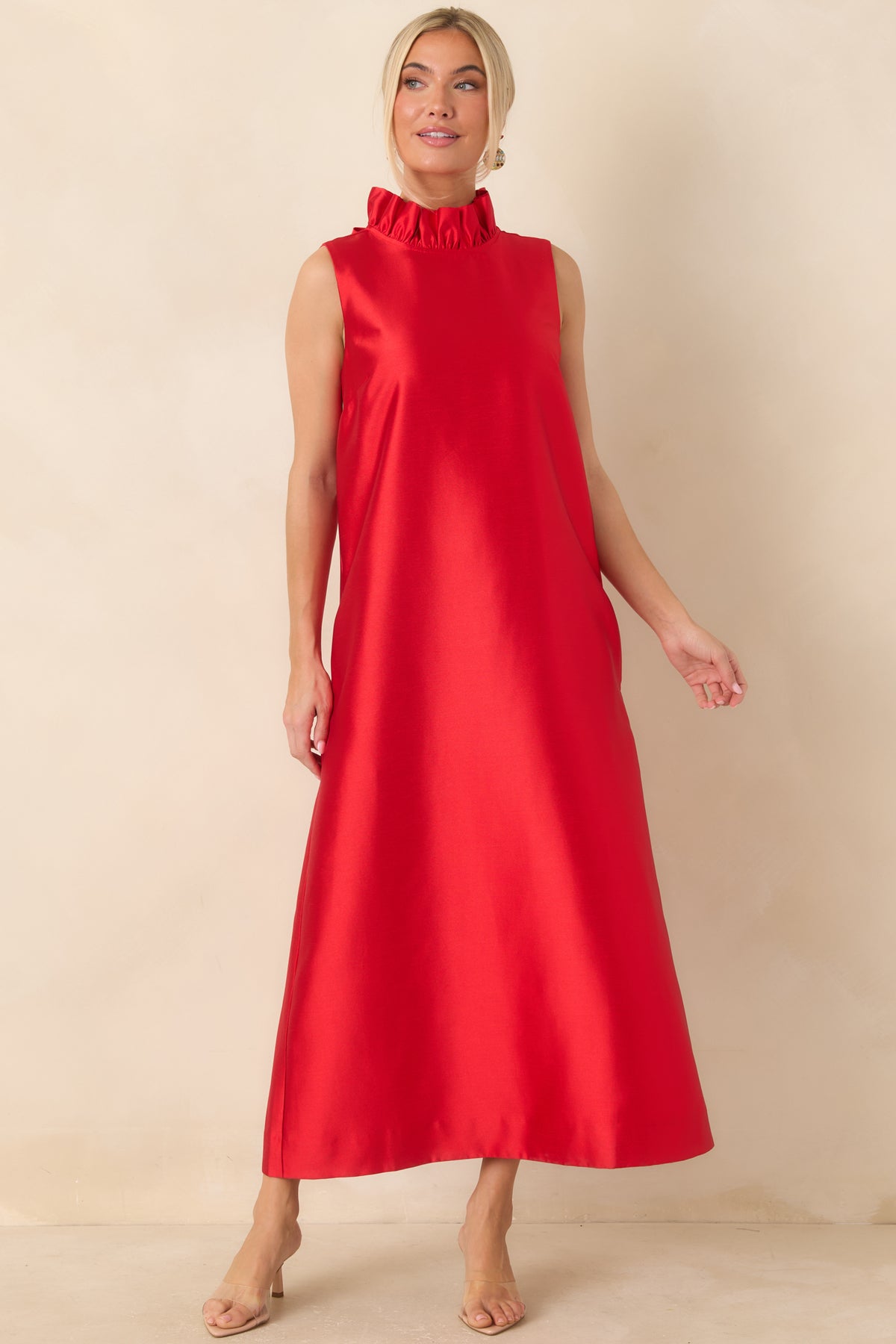 Vibrant red maxi dress with a sleeveless cut, delicate ruffle mock neck, and clean flowing lines.