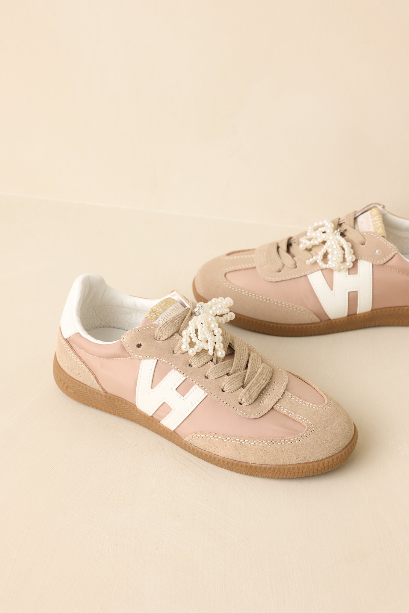 Three-quarter view showcasing the interchangeable lace styling options and structured design.