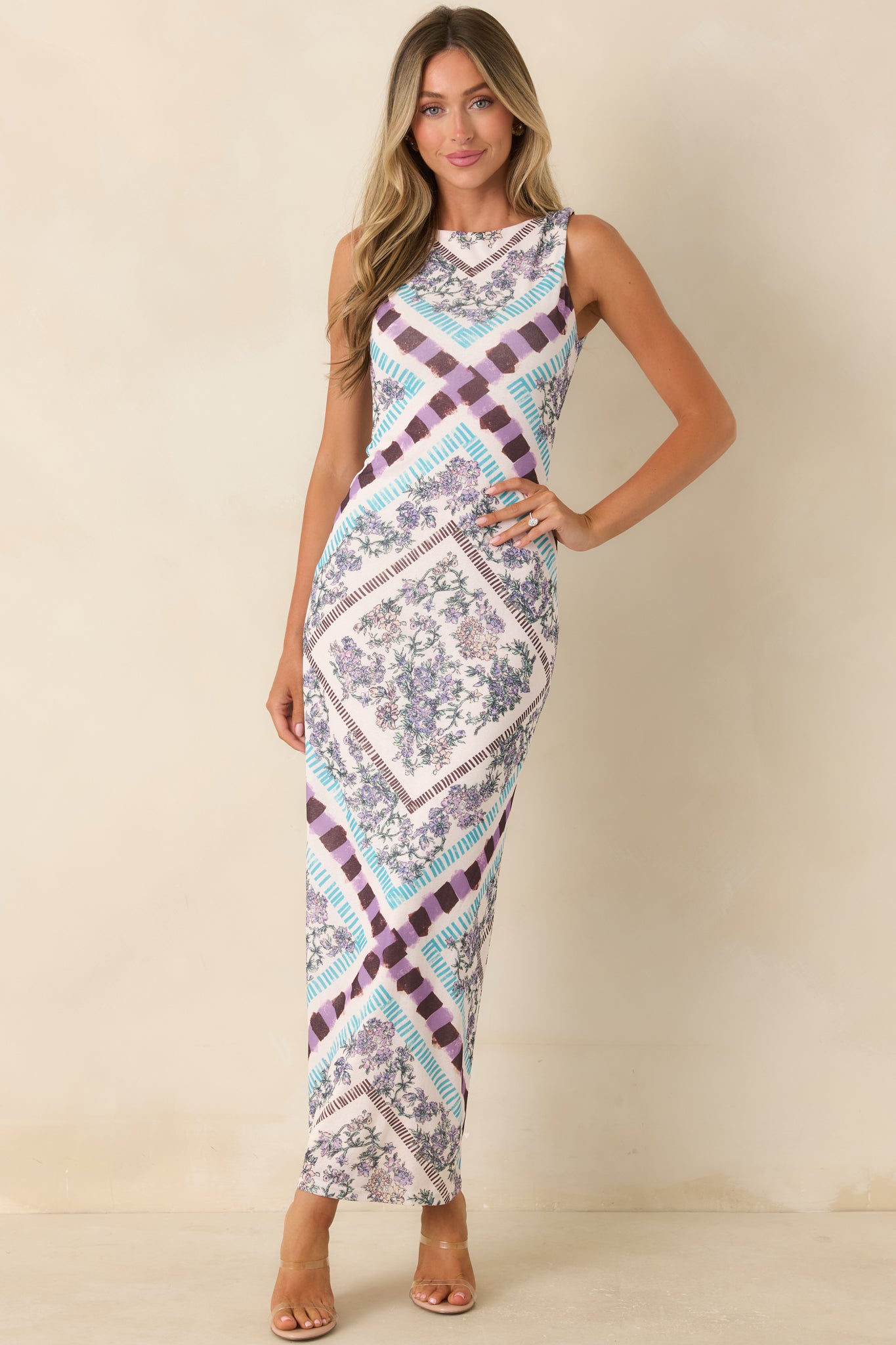 Vintage-inspired floral midi dress with an elegant column shape and softly skimming silhouette.