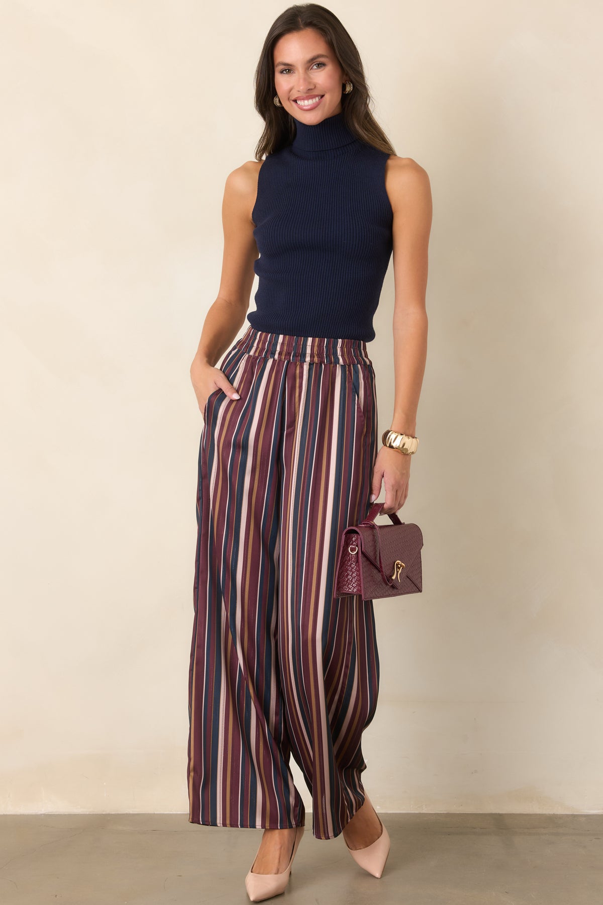 Vintage-inspired striped pants featuring a pull-on design and wide leg silhouette.
