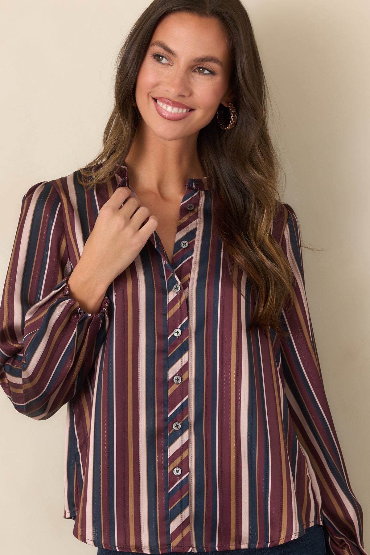 Vintage-inspired striped top showcasing the smooth satin finish and band collar.