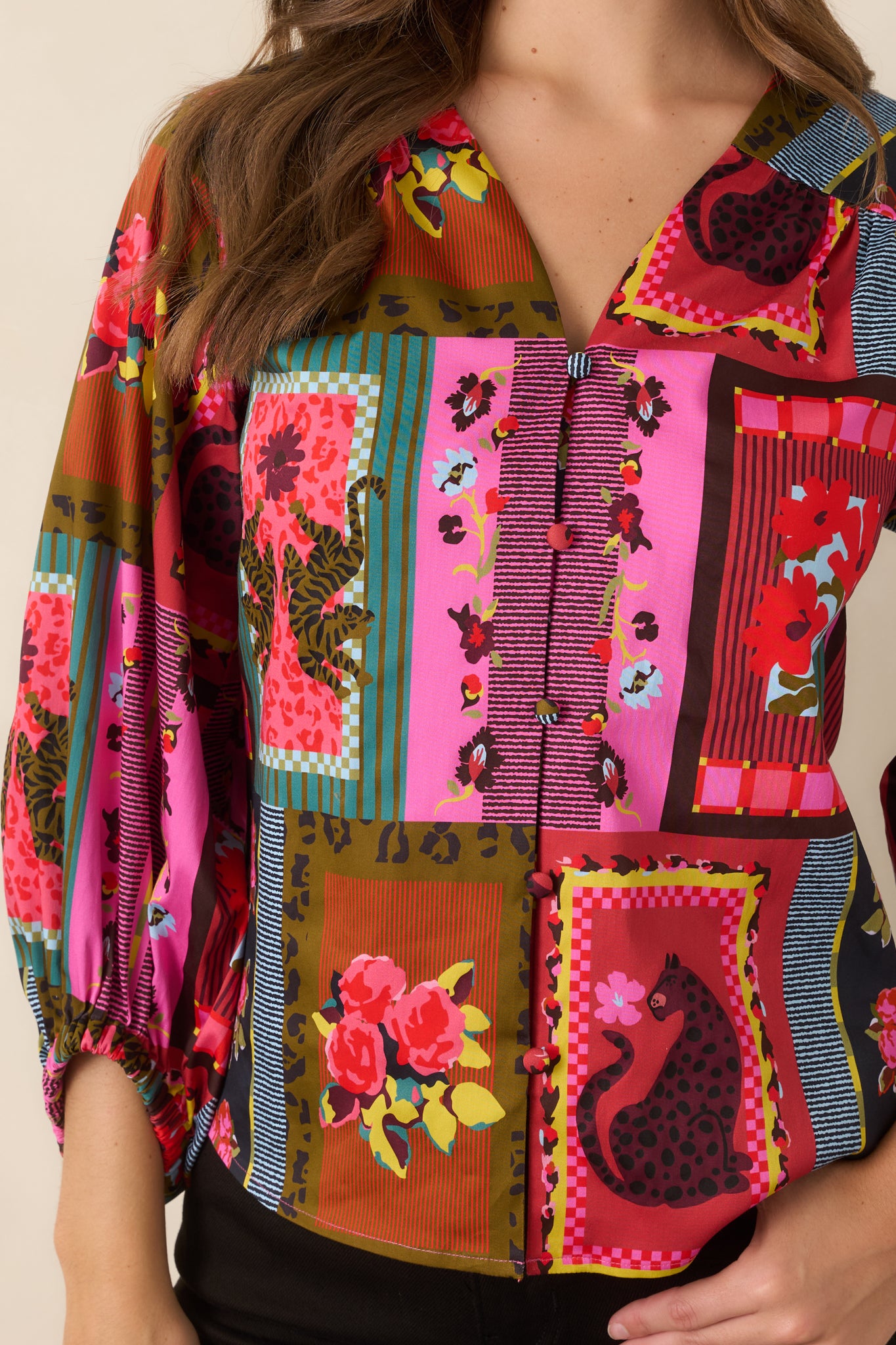 Close-up of the Vintage Vignette print highlighting intricate florals, graphic stripes, framed motifs, and playful animal accents.