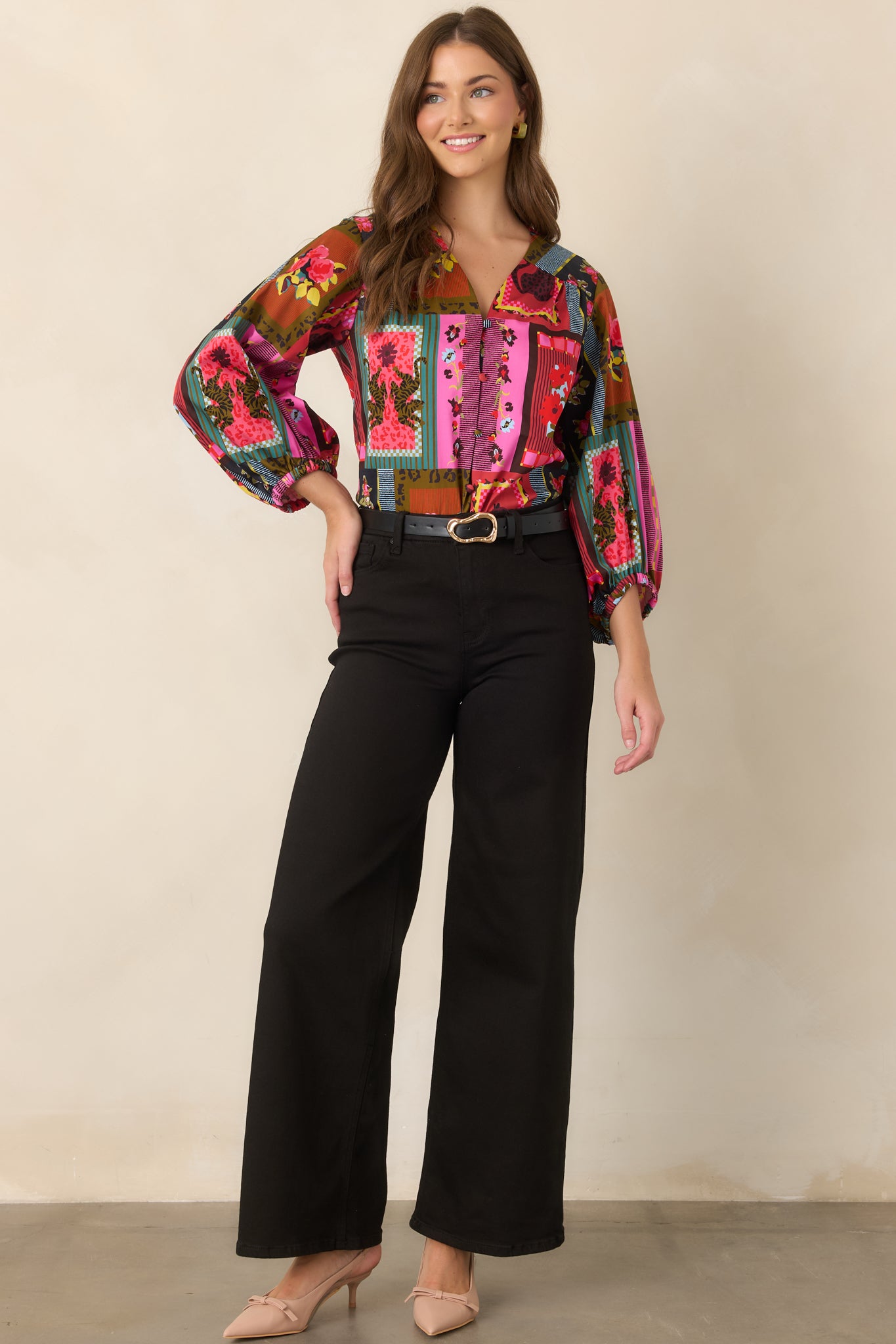 Statement Vintage Vignette blouse displaying its eclectic combination of floral patterns, stripes, framed designs, and whimsical animal details.