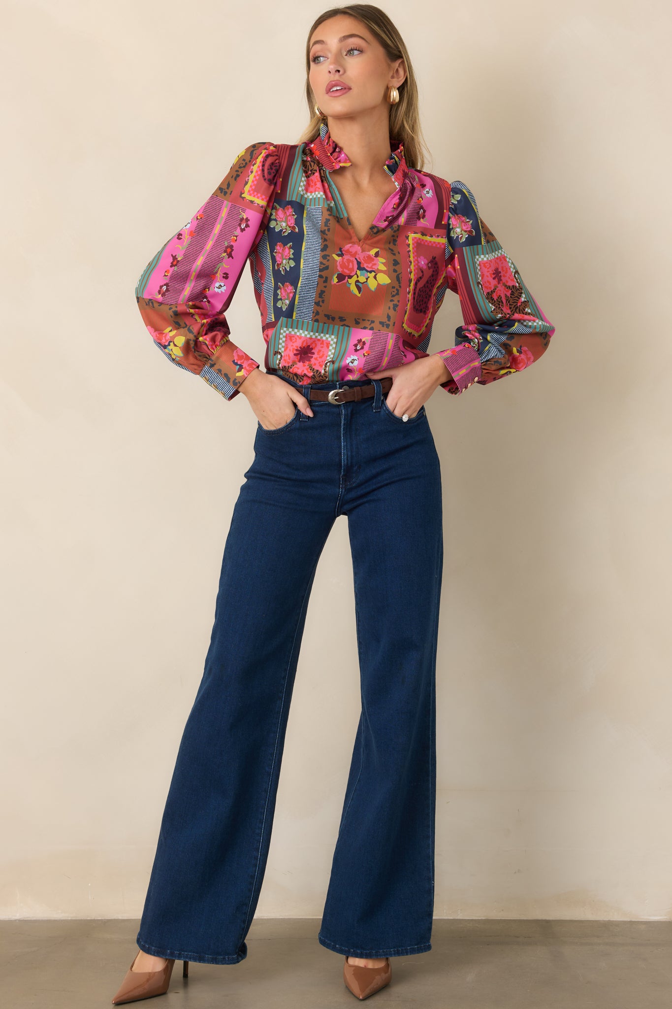 Vintage Vignette print top showcasing its flowing drape, ruffled split neckline, gathered shoulders, voluminous blouson sleeves, and colorful mix of floral and framed motifs.