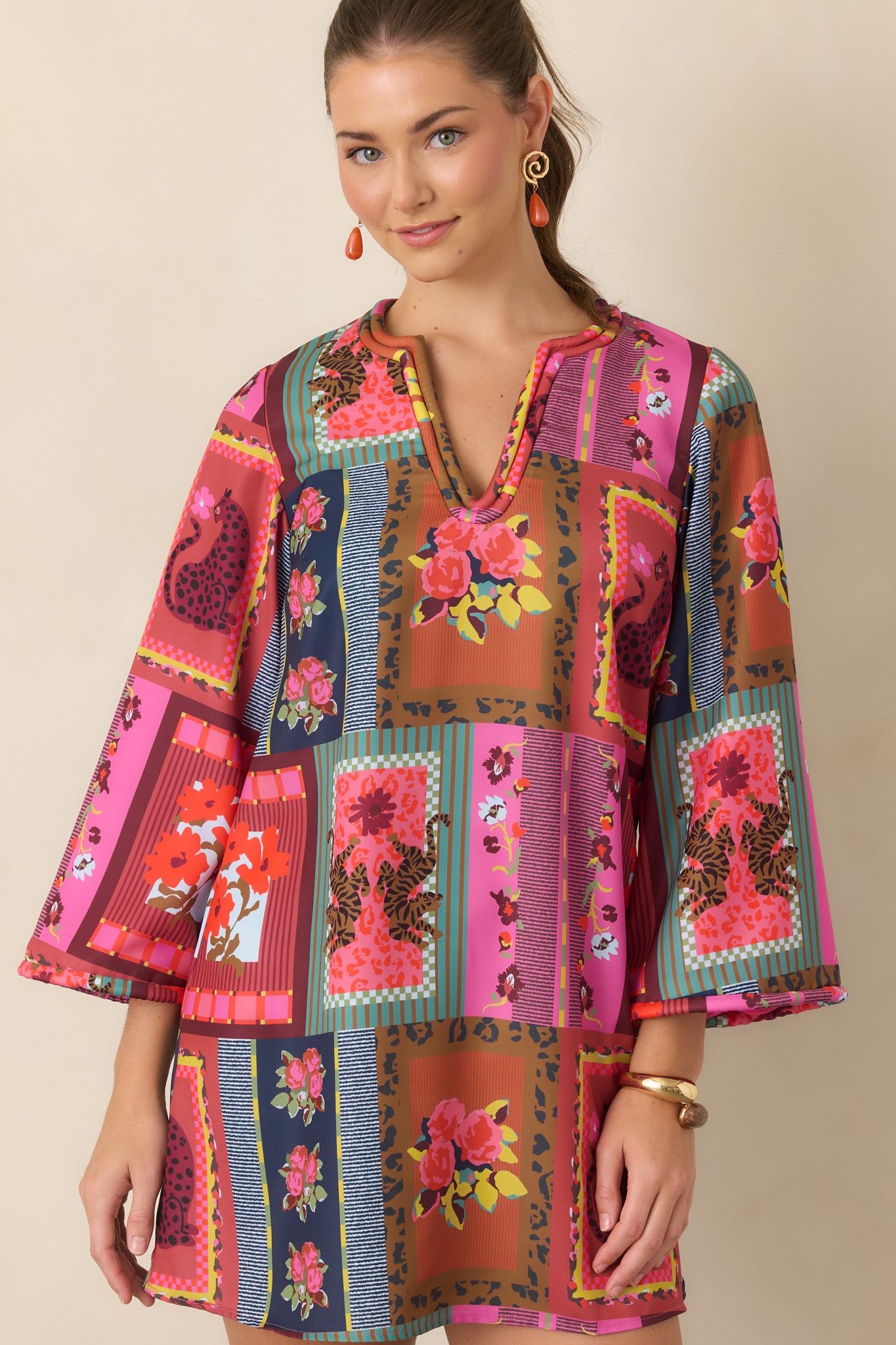 Close view of the playful mini dress featuring its relaxed A-line shape, colorful Vintage Vignette pattern, and softly finished corded V-neckline.