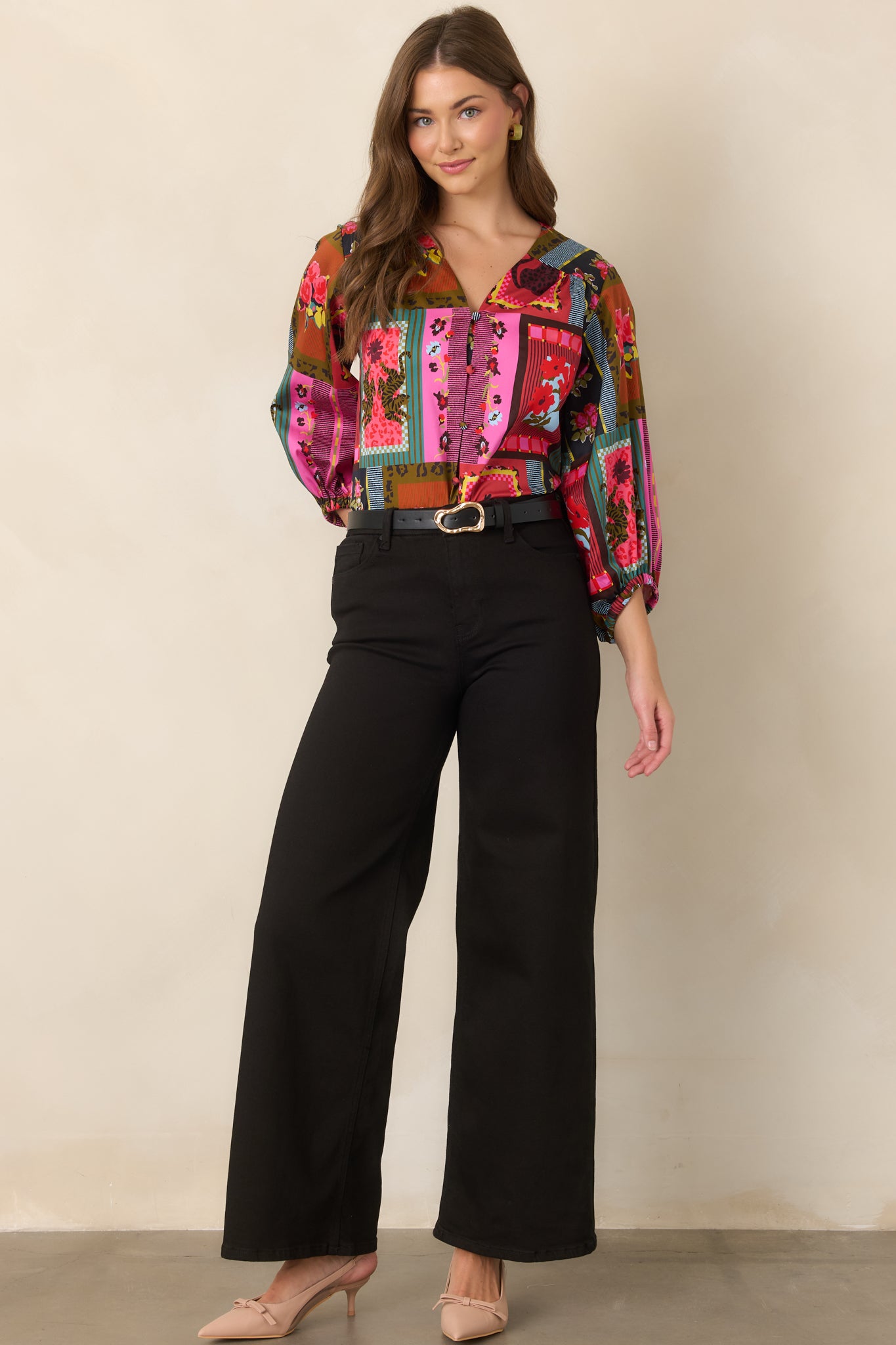 Vintage Vignette print top showcasing its relaxed silhouette, open V-neckline, dramatic balloon sleeves, gathered cuffs, and colorful mix of playful motifs.