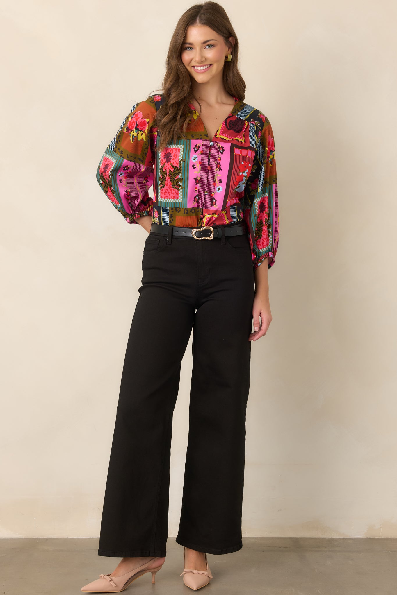 Vintage Vignette print top featuring a flattering V-neckline, voluminous three-quarter balloon sleeves, gathered cuffs, and an easy flowing fit.