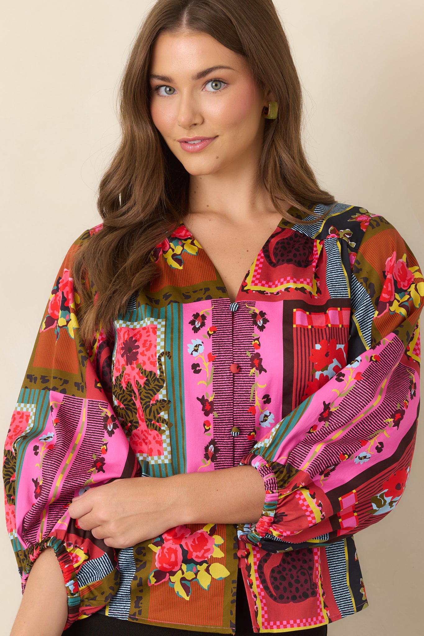 Vintage Vignette top detail highlighting the open V-neckline and colorful arrangement of floral, striped, framed, and animal-inspired motifs.