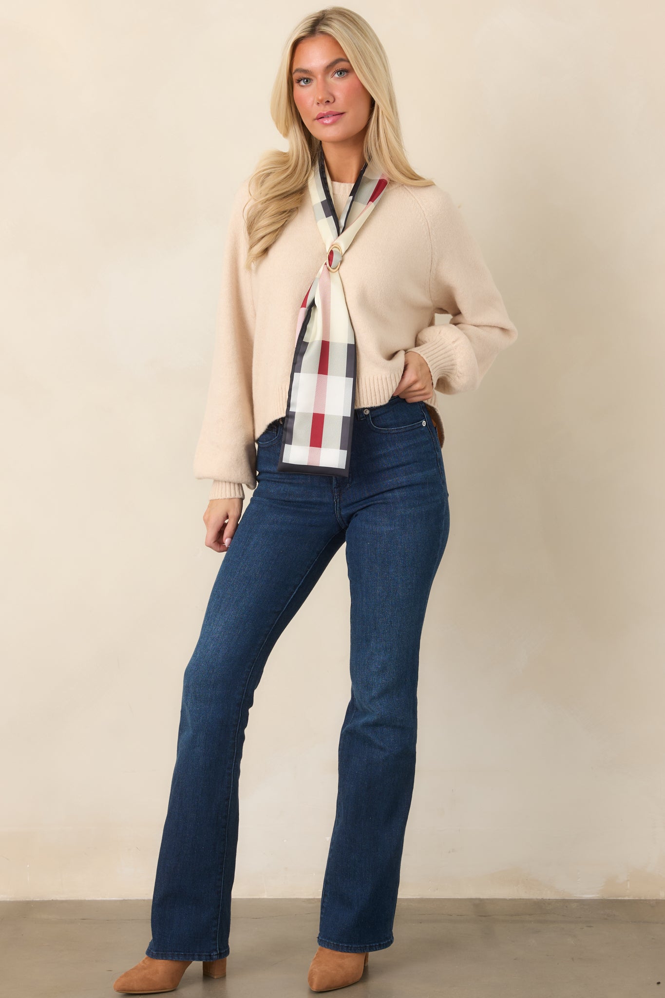 Warm soft ecru knit top showcasing its cozy plush texture, rounded crew neckline, full raglan sleeves, ribbed trim, and softly cropped shape.
