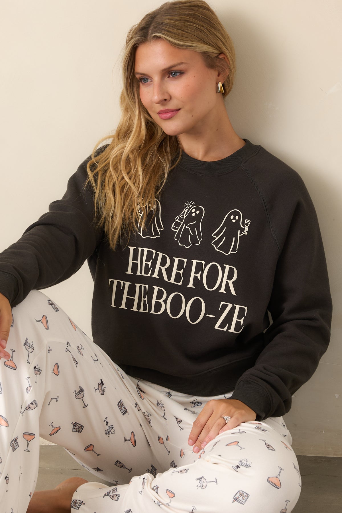 Washed black cotton-blend sweatshirt with three cocktail-carrying ghosts and oversized “Here for the Boo-ze” text across the front.